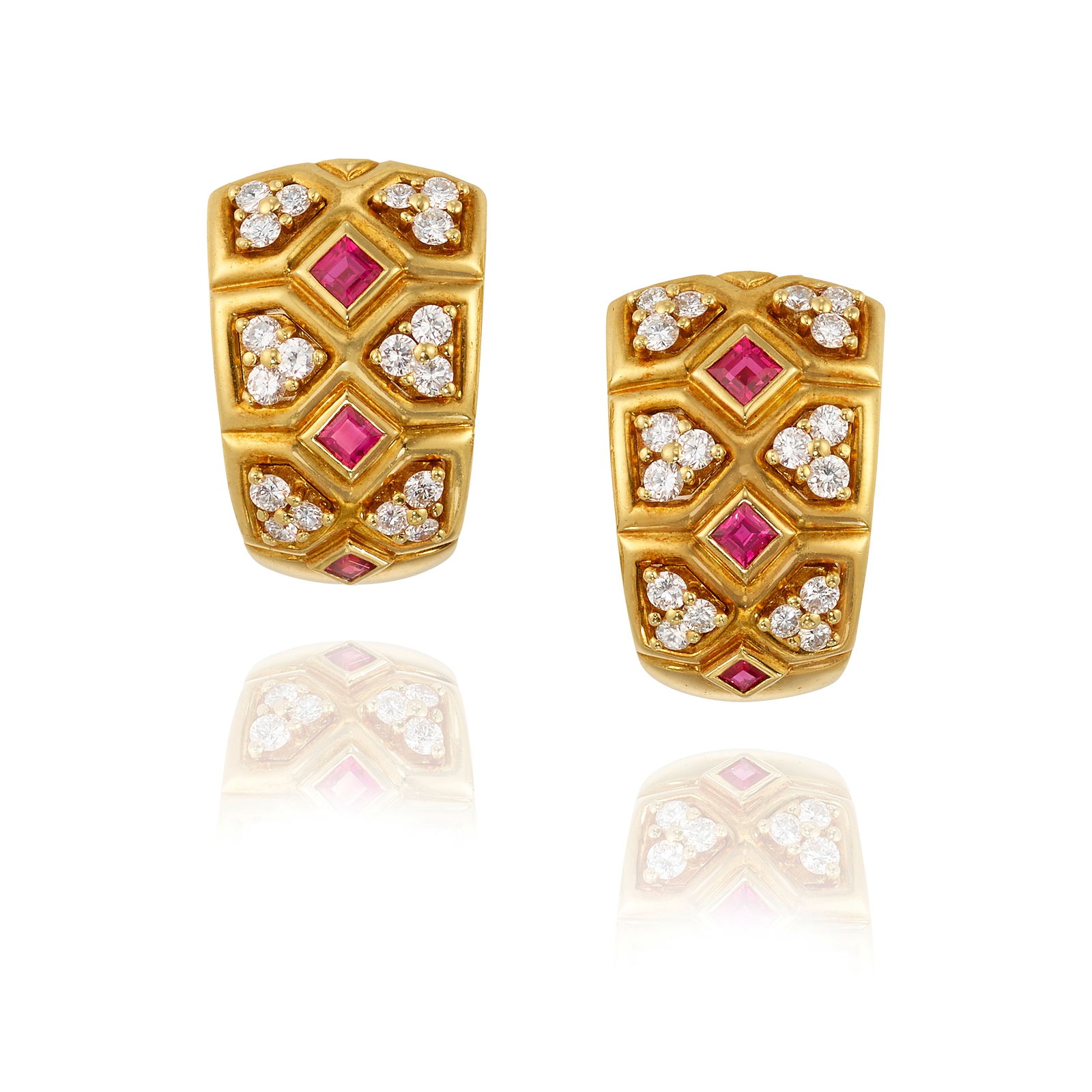 VAN CLEEF & ARPELS: A PAIR OF 18K GOLD, RUBY AND DIAMOND EARCLIPS: VAN CLEEF & ARPELS: A PAIR OF 18K GOLD, RUBY AND DIAMOND EARCLIPS Of geometric design, set with square, step-cut rubies, accented with round brilliant-cut diamonds; signed Van Cleef & Arpels; with mak
