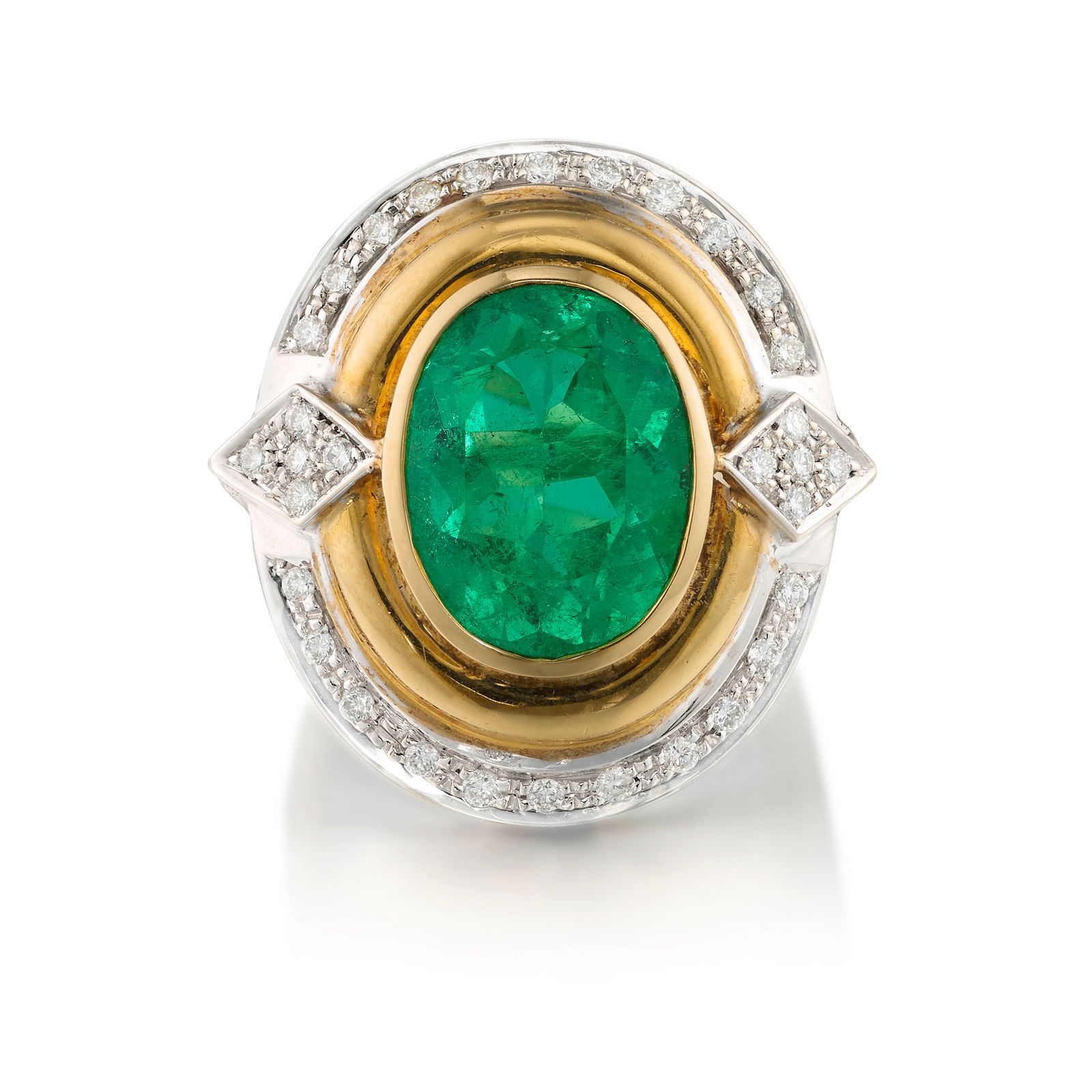 AN EMERALD AND DIAMOND RING: AN EMERALD AND DIAMOND RINGCentering an oval-shaped emerald, mounted in yellow gold and accented with round brilliant-cut diamonds; estimated emerald weight 6.85 carats; mounted in 18k gold; size