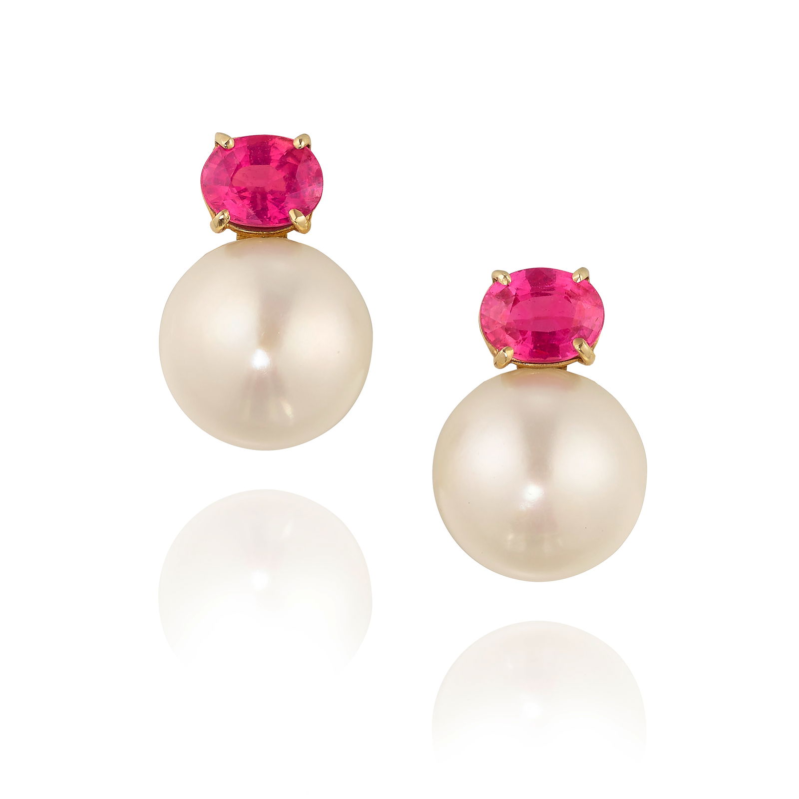 A PAIR OF CULTURED PEARL AND PINK SAPPHIRE EARCLIPS: A PAIR OF CULTURED PEARL AND PINK SAPPHIRE EARCLIPS Comprising button cultured pearls and oval-shaped pink sapphires; estimated total pink sapphire weight 2.80 carats; mounted in 14k gold; measures 3/