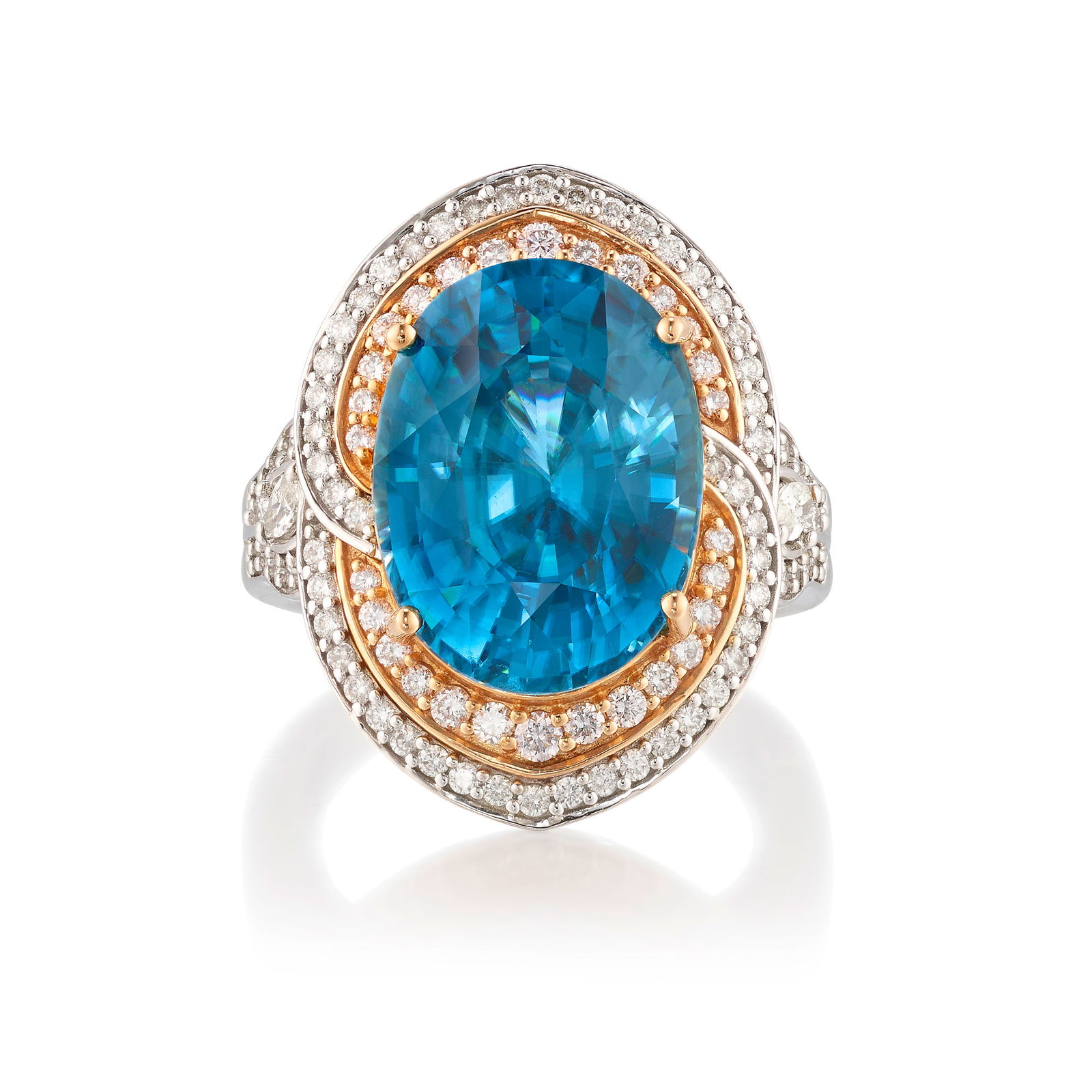 AN 18K BICOLOR GOLD, ZIRCON AND DIAMOND RING: AN 18K BICOLOR GOLD, ZIRCON AND DIAMOND RING Centering an oval-shaped, greenish blue zircon, mounted in white and pink gold, accented with round brilliant-cut and marquise-shaped diamonds; with maker