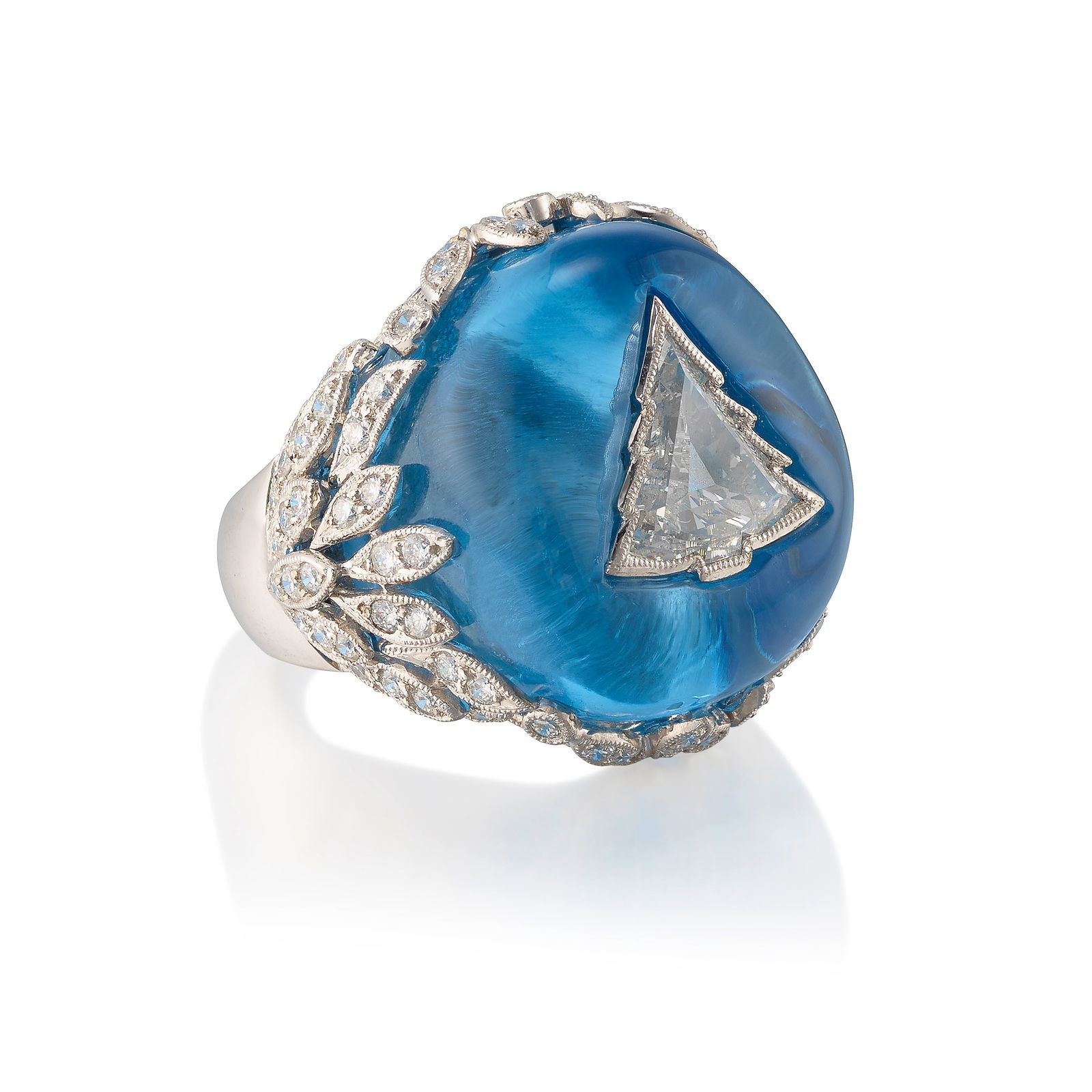 AN 18K WHITE GOLD, DIAMOND AND TOPAZ RING: AN 18K WHITE GOLD, DIAMOND AND TOPAZ RINGCentering a fantasy-cut diamond in a carved topaz mounting, the gallery accented with round brilliant-cut diamonds; estimated total weight 0.80 carat; size