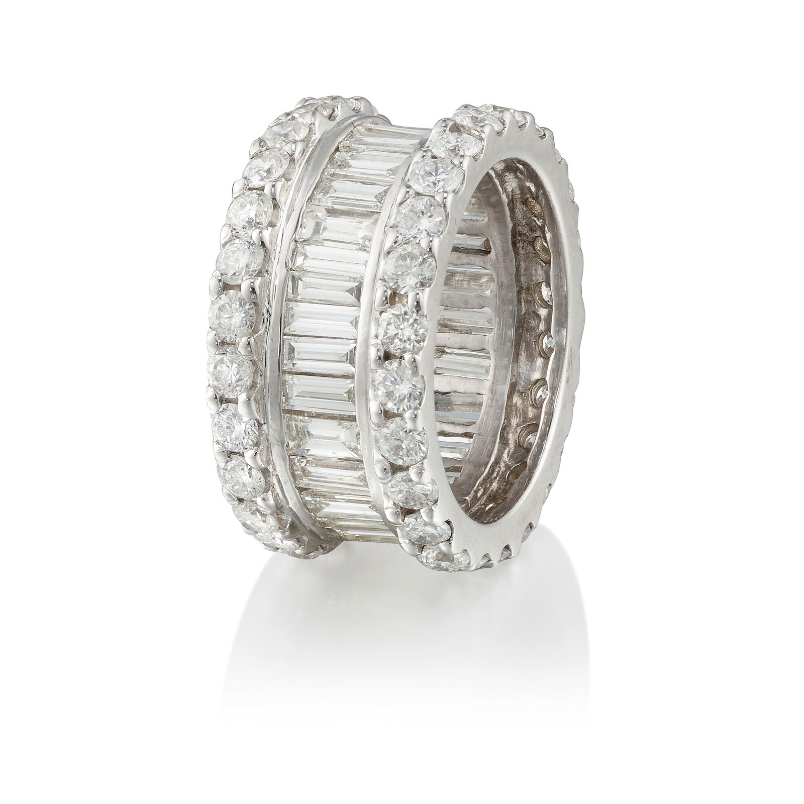 AN 18K WHITE GOLD AND DIAMOND RING: AN 18K WHITE GOLD AND DIAMOND RINGComprising rows of round brilliant and baguette-cut diamonds; estimated total weight 5.85 carats; size 7Footnotes:OVERALL CONDITION:Metal stamped and tested with XRF