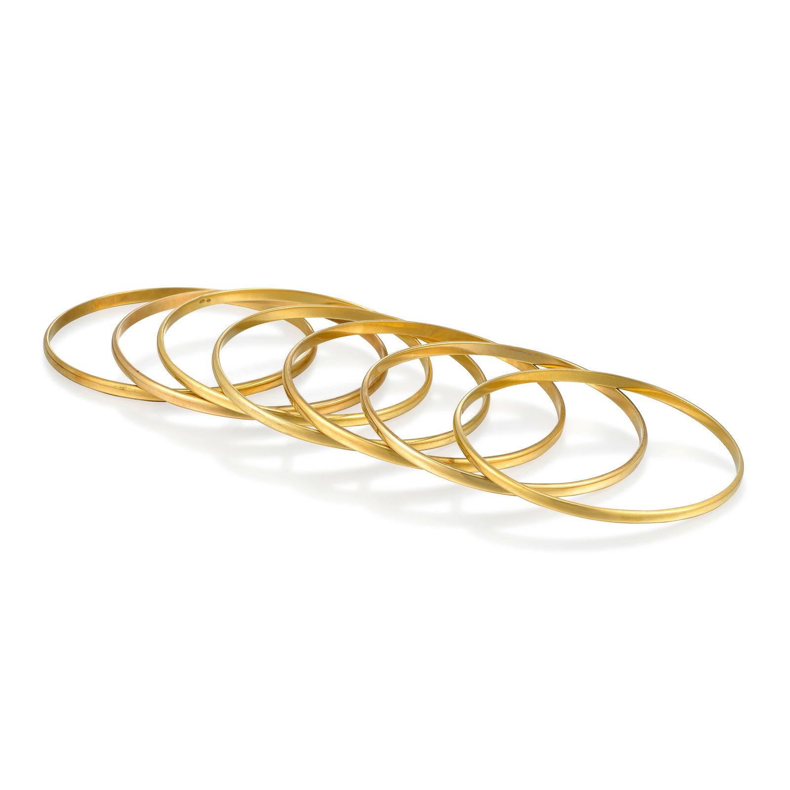 A SET OF GOLD BANGLES (1 of 1)