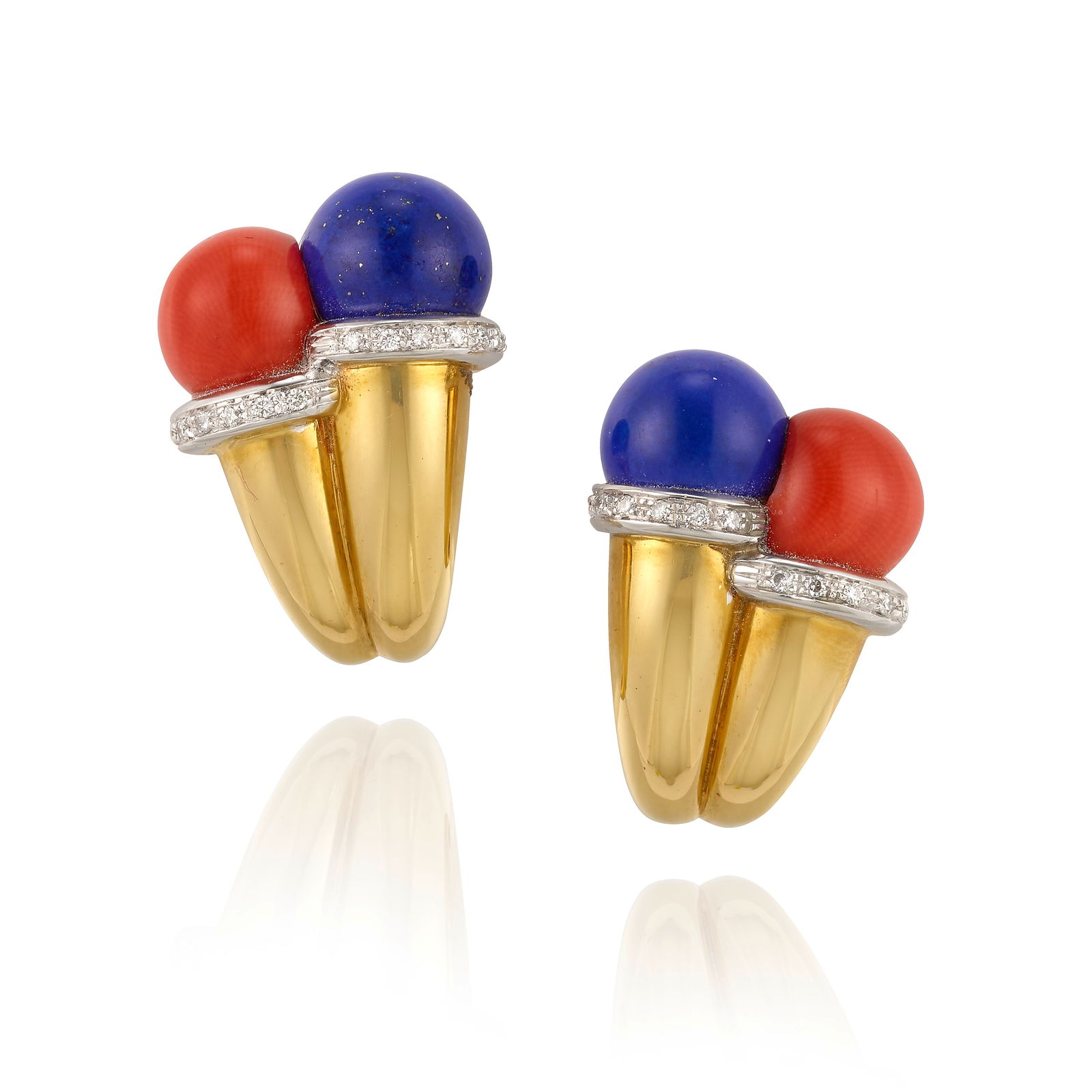 A PAIR OF 18K BICOLOR GOLD, LAPIS LAZULI, CORAL AND DIAMOND EARCLIPS: A PAIR OF 18K BICOLOR GOLD, LAPIS LAZULI, CORAL AND DIAMOND EARCLIPSComprising round cabochon lapis lazuli and coral, mounted in bands of white gold accented with round brilliant-cut diamonds; with