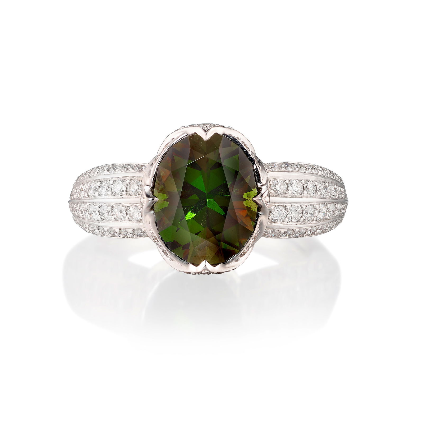 KAT FLORENCE: AN 18K WHITE GOLD, SPHENE AND DIAMOND RING: KAT FLORENCE: AN 18K WHITE GOLD, SPHENE AND DIAMOND RINGCentering an oval-shaped sphene, accented with round brilliant-cut diamonds; signed Kat Florence; with certificate of authenticity; estimated