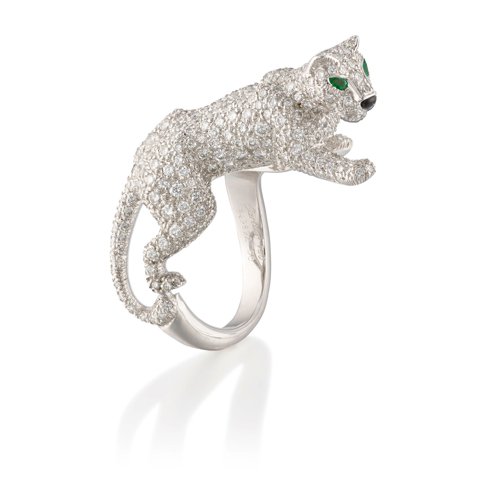 CARTIER: AN 18K WHITE GOLD AND DIAMOND 'PANTHÈRE DE CARTIER' RING: CARTIER: AN 18K WHITE GOLD AND DIAMOND 'PANTHÈRE DE CARTIER' RINGDesigned as a stalking panther, pavé-set with round brilliant-cut diamonds, accented with pear-shaped emerald eyes and a