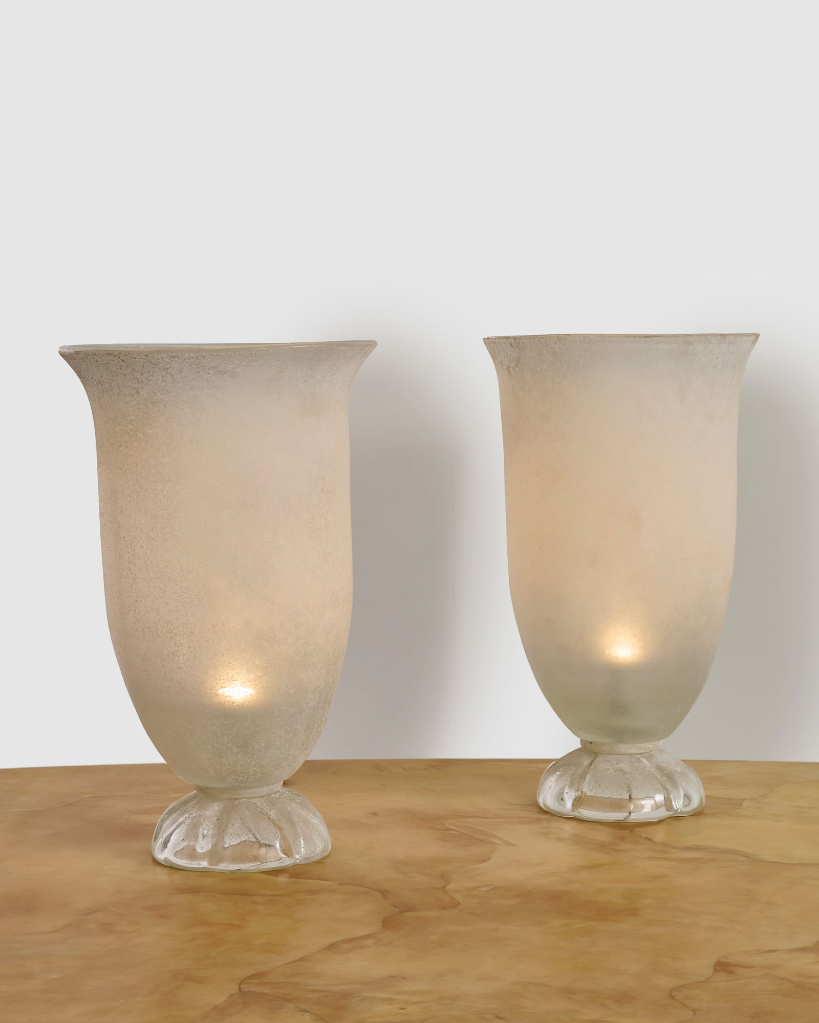 KARL SPRINGER (1931-1991) Pair of 'Venetian Glass Table Top Torcheres'circa 1980for Seguso Vetri...: KARL SPRINGER (1931-1991) Pair of 'Venetian Glass Table Top Torcheres' circa 1980 for Seguso Vetri d'Arte, scavo glass height 25 1/2in (64.7cm); diameter 14 1/2in (37cm) Footnotes: Literature Red Bind