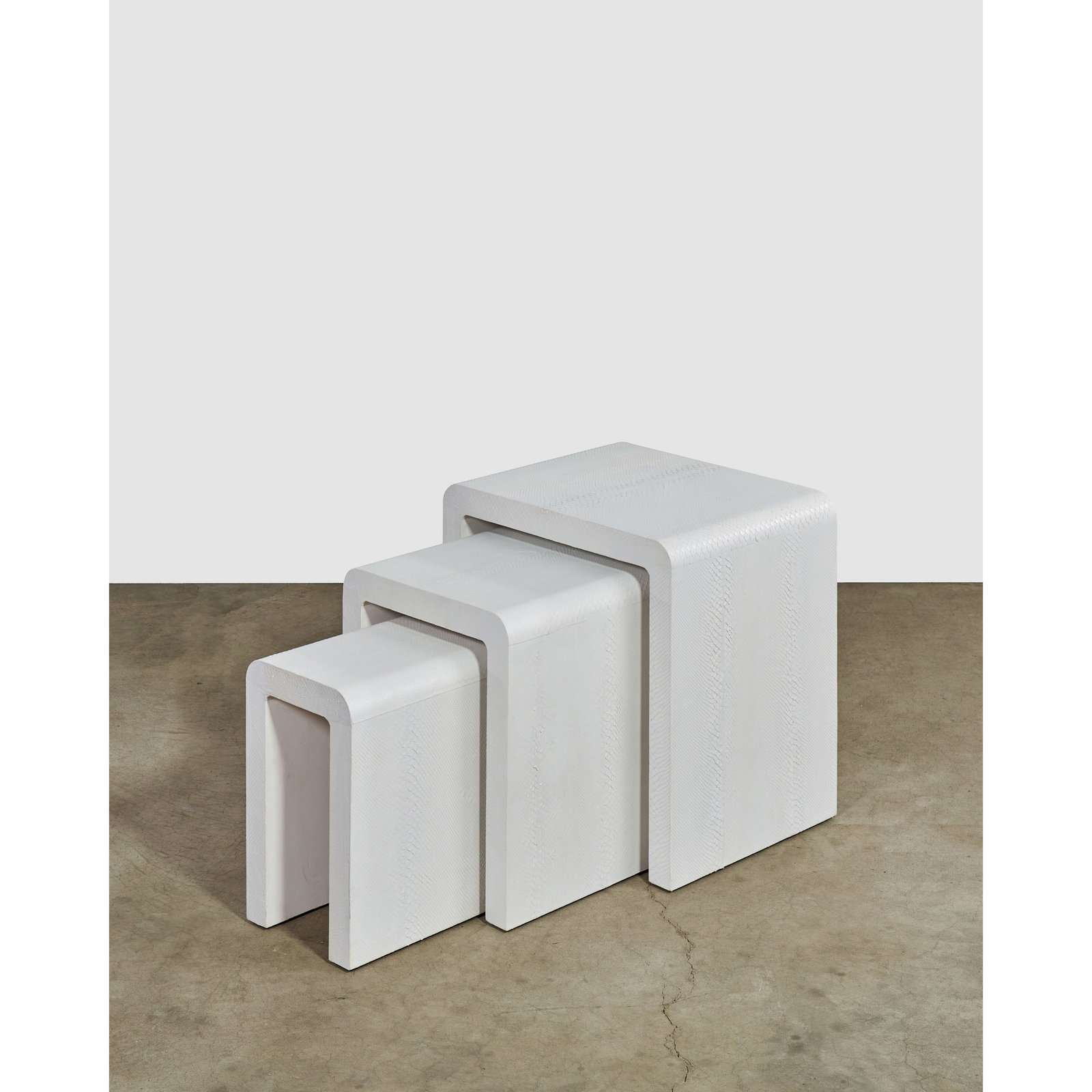 KARL SPRINGER (1931-1991) 'Waterfall' Nesting Tablescirca 1980for Karl Springer Ltd., wood, whit... (1 of 1)