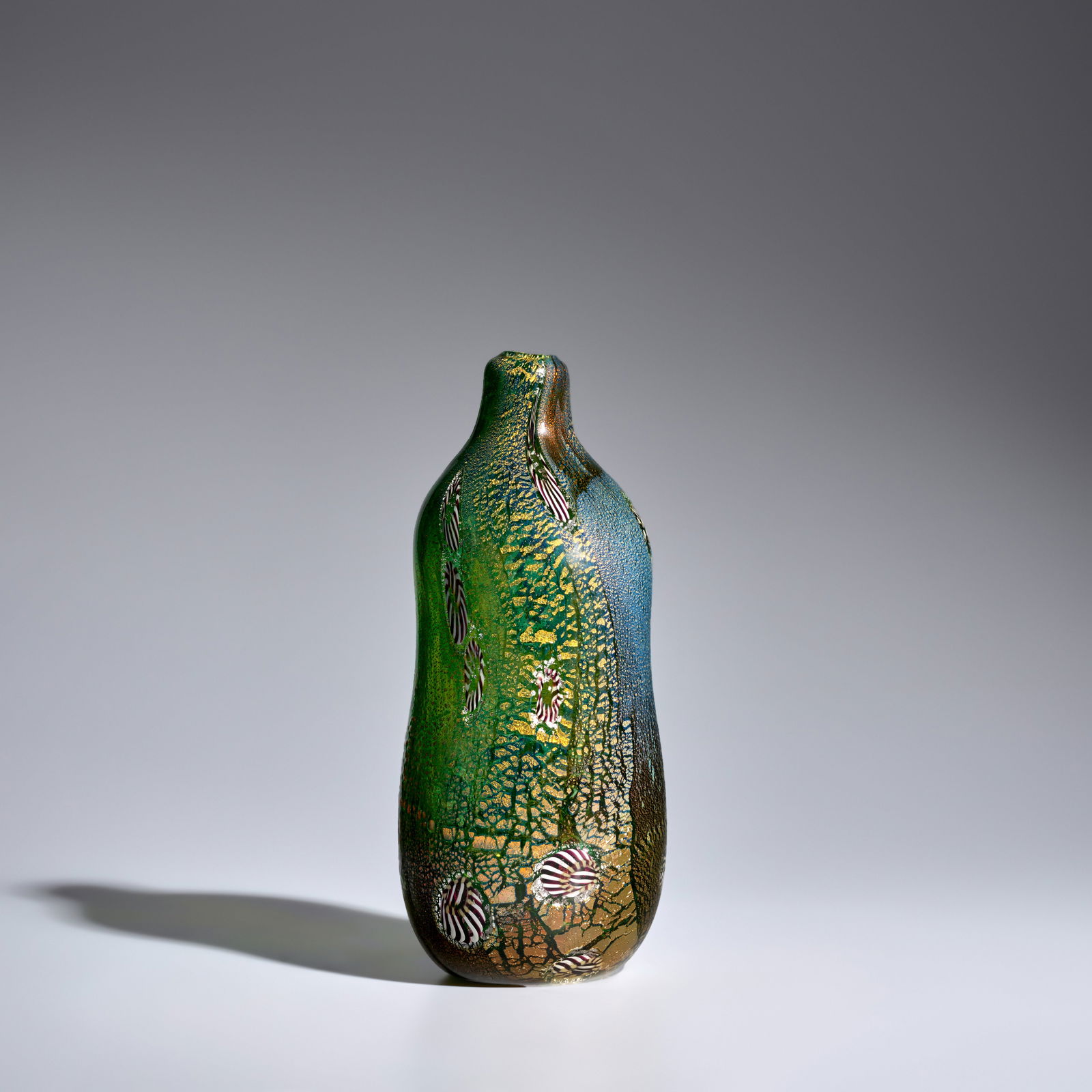 ALDO NASON (BORN 1920) Vasecirca 1965for A.V.E.M., glass internally decorated with gold foil and...: ALDO NASON (BORN 1920) Vase circa 1965 for A.V.E.M., glass internally decorated with gold foil and murrines, engraved 'Nason Aldo Carlo Dedi' height 11 1/4in (28.5cm); diameter 4 1/2in (11.5cm) Footno