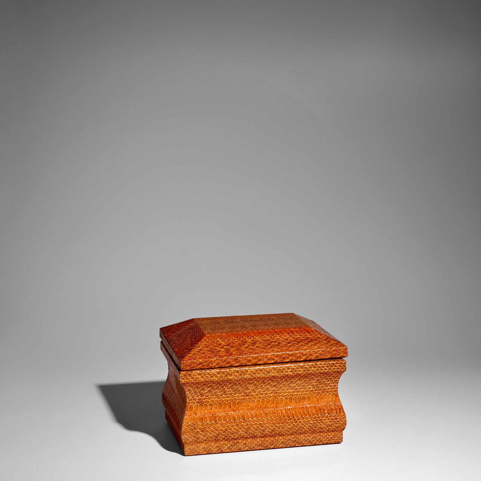 KARL SPRINGER (1931-1991) Hinged 'Molding' Boxcirca 1980for Karl Springer Ltd., chestnut cobra, ...: KARL SPRINGER (1931-1991) Hinged 'Molding' Box circa 1980 for Karl Springer Ltd., chestnut cobra, fabric interior, steel height 7 3/8in (9cm); width 10 1/2in (26.5cm); depth 8 1/2in (21.5cm) This lot