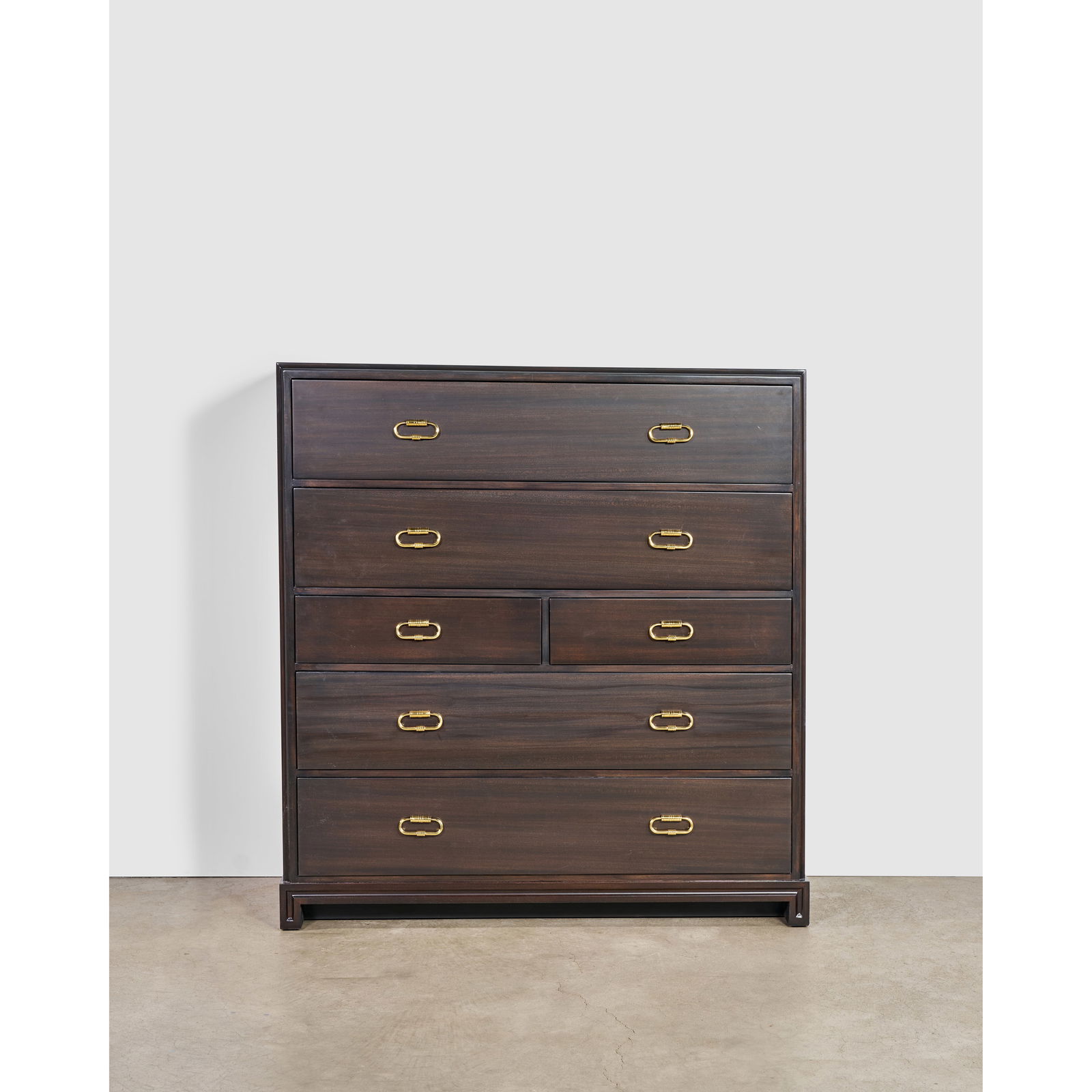 TOMMI PARZINGER (1930-1991) Tall Chest of Drawerscirca 1950for Parzinger Originals, mahogany, br...: TOMMI PARZINGER (1930-1991) Tall Chest of Drawers circa 1950 for Parzinger Originals, mahogany, brass, branded mark 'parzinger originals' height 53 1/2in (136cm); length 50in (127cm); depth 17 3/4in (