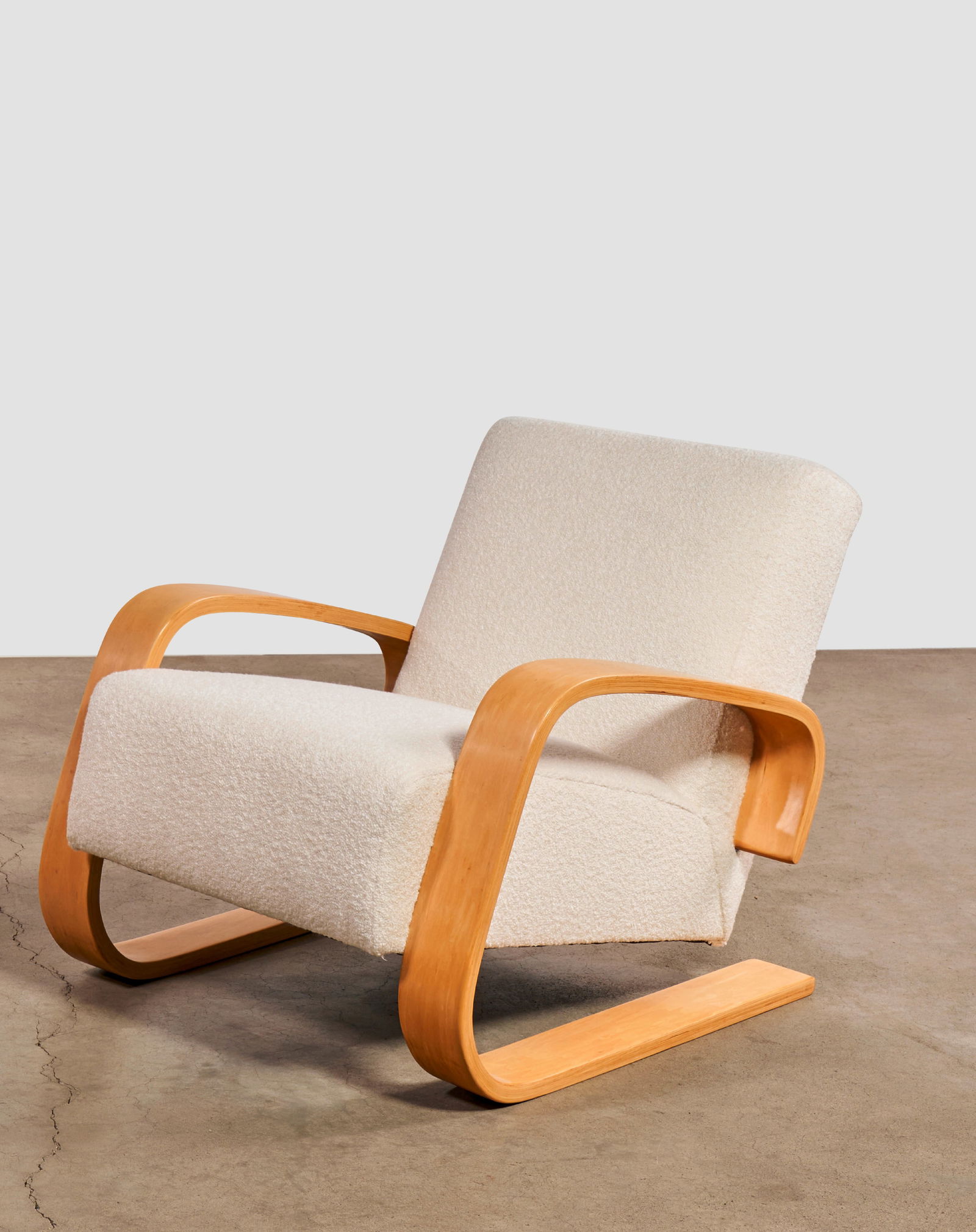 ALVAR AALTO (1898-1976) 'Tank' Armchair1960smodel no. 37/400, for Artek, laminated birch plywood...: ALVAR AALTO (1898-1976) 'Tank' Armchair 1960s model no. 37/400, for Artek, laminated birch plywood, boucle upholstery height 28 1/2in (79.5cm); width 28 1/2in (79.5cm); depth 33in (82.8cm) Footnotes: