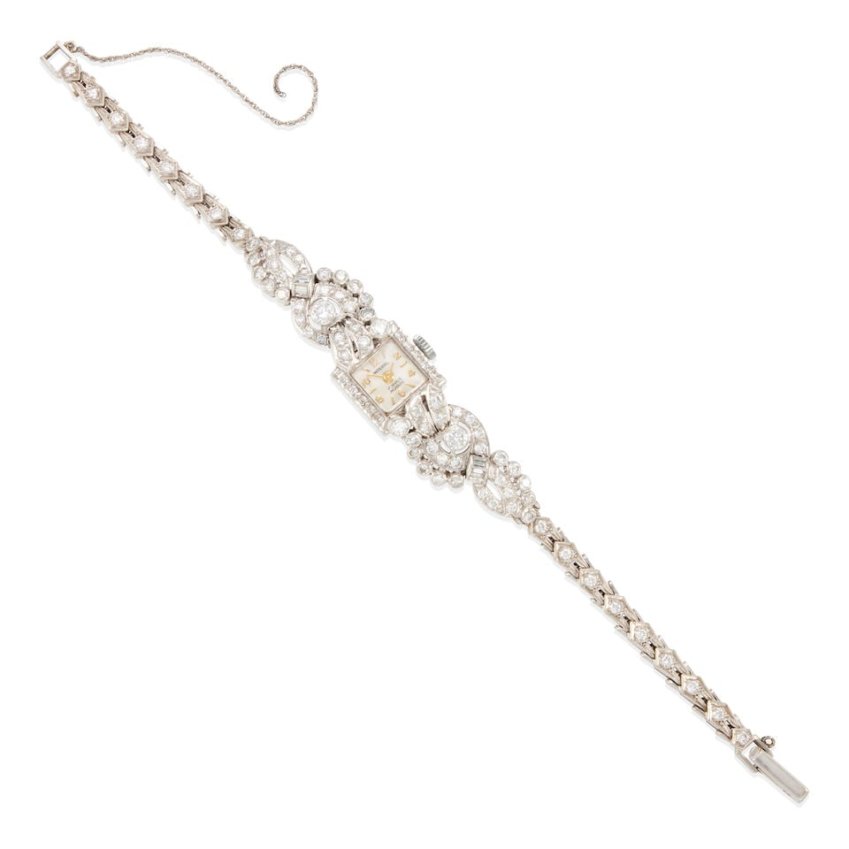 IMPERIAL: PLATINUM, 14K WHITE GOLD AND DIAMOND WRISTWATCH: IMPERIAL: PLATINUM, 14K WHITE GOLD AND DIAMOND WRISTWATCH • Platinum case, 14k white gold bracelet • Numerous round and baguette diamonds weighing approximately 2.95 - 3.00 carats