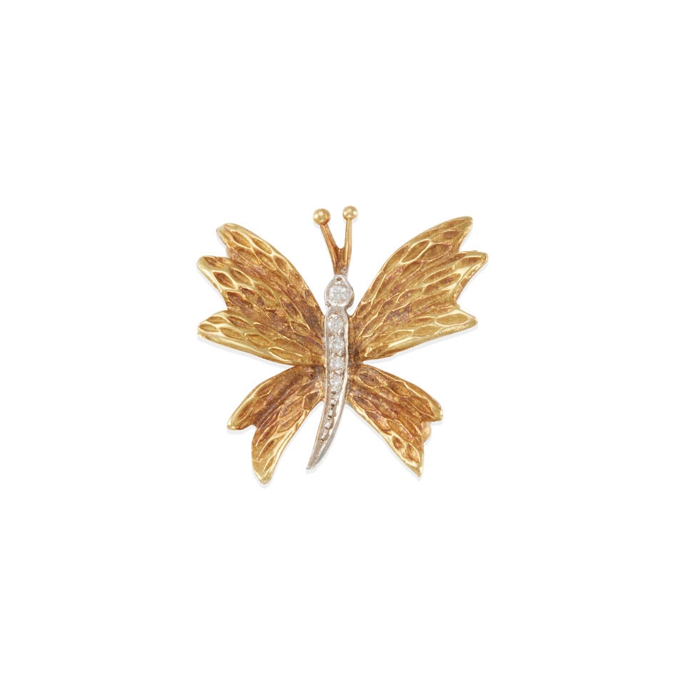 TIFFANY & CO.: 18K GOLD AND DIAMOND BROOCH: TIFFANY & CO.: 18K GOLD AND DIAMOND BROOCH • 18k yellow and white gold • Numerous round diamonds weighing approximately 0.02 - 0.06 carat total • Signed Tiffany & Co. •