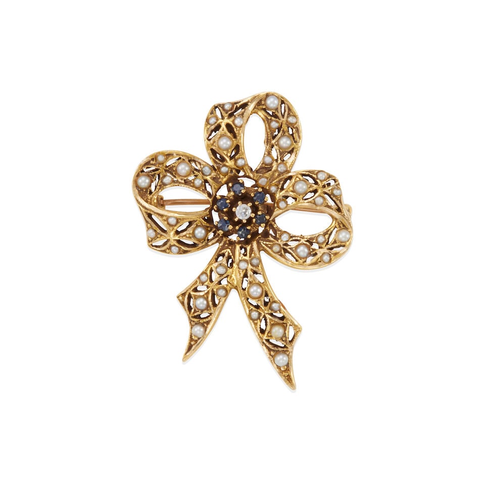 10K GOLD, CULTURED PEARL, SAPPHIRE, AND DIAMOND BOW PENDANT/BROOCH: 10K GOLD, CULTURED PEARL, SAPPHIRE, AND DIAMOND BOW PENDANT/BROOCH • 10k yellow gold • Numerous spherical and semi-spherical undrilled cultured pearls measuring 1.25 mm to 2.00 mm each in