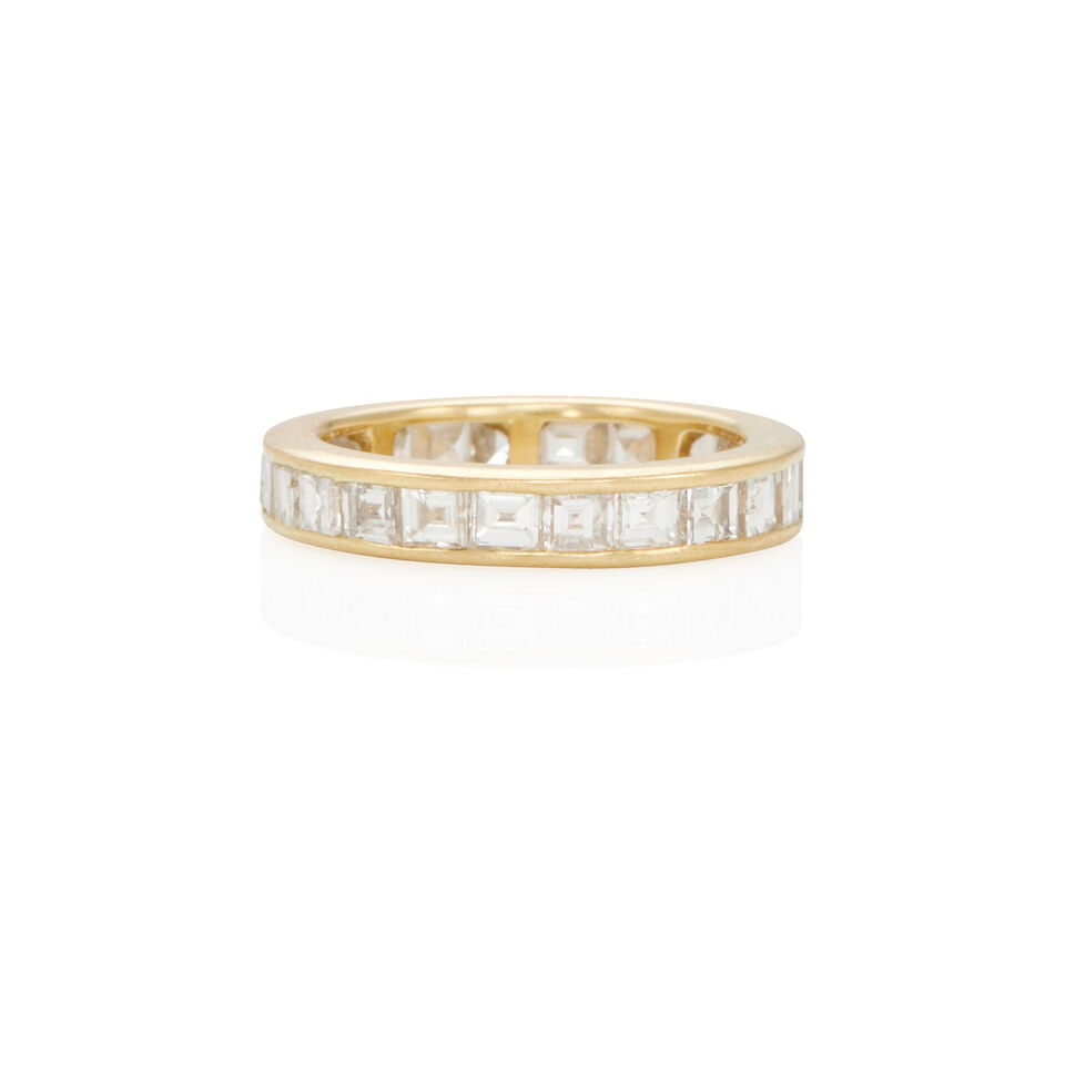 18K GOLD AND DIAMOND ETERNITY BAND: 18K GOLD AND DIAMOND ETERNITY BAND • 18k yellow gold • Numerous rectangular and square diamonds weighing approximately 1.65 - 1.75 carat total • Size 6 • Estimated gross