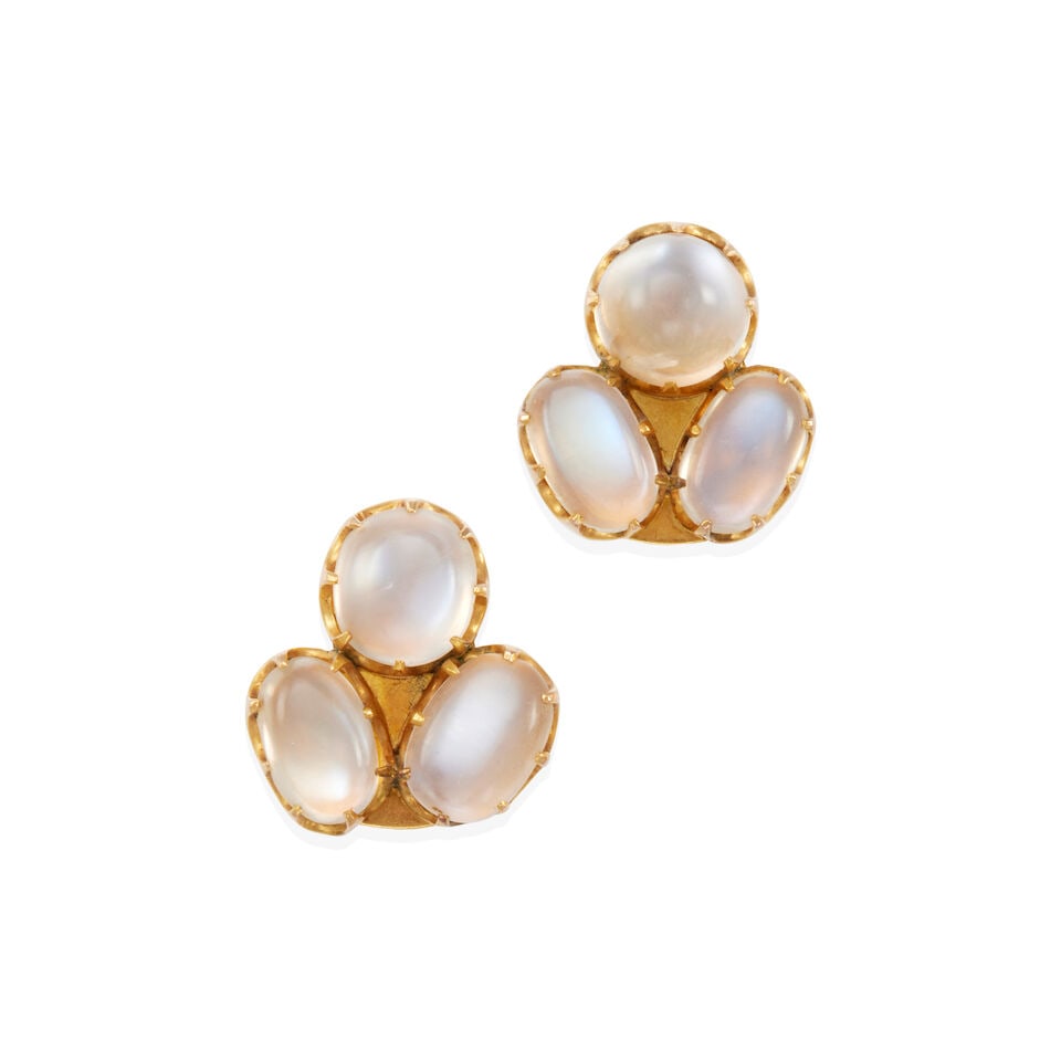 PAIR OF 14K GOLD AND MOONSTONE EARCLIPS: PAIR OF 14K GOLD AND MOONSTONE EARCLIPS • 14k yellow gold • 6 moonstone cabochons 9.35 - 10.76mm • Marked PAT. 156452 • Measures 3/4 x 3/4 in. • Estimated gross weight: