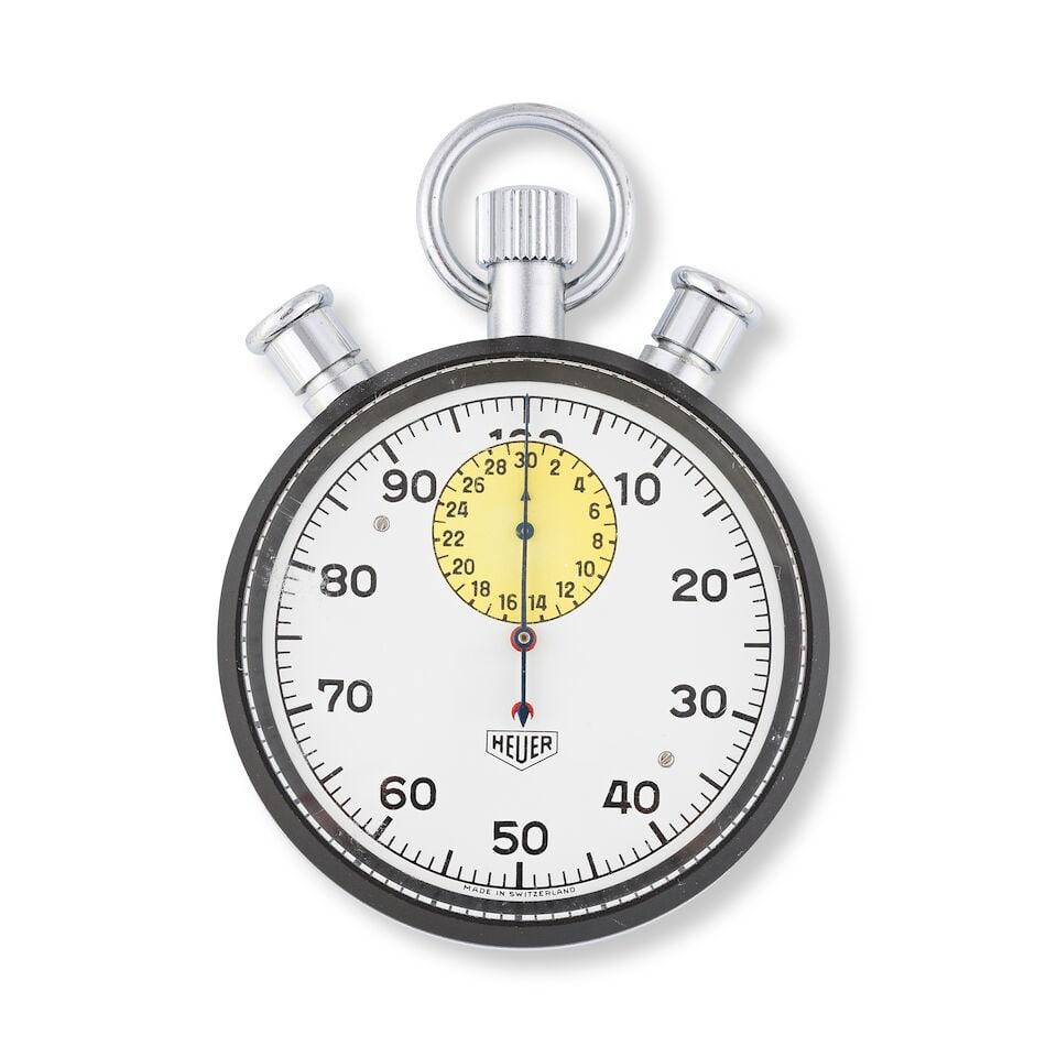 Heuer. A coated stainless steel open face keyless wind split second chronograph stopwatch Heuer....: Heuer. A coated stainless steel open face keyless wind split second chronograph stopwatch Heuer. Chronographe stopwatch à cadran ouvert et fonction rattrapante en acier et PVD noir remontoir au