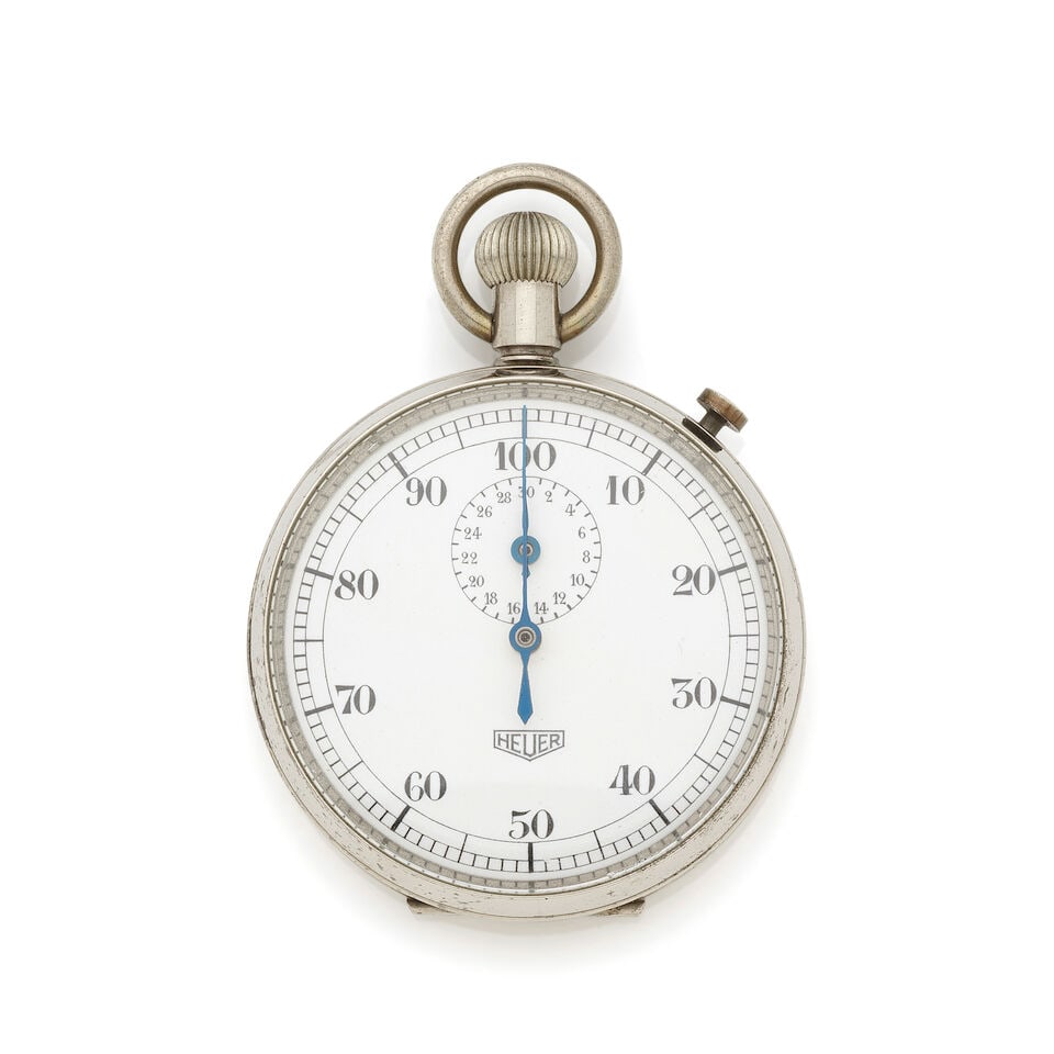 Heuer. A stainless steel open face keyless wind chronograph stopwatch Heuer. Chronographe stopwa...: Heuer. A stainless steel open face keyless wind chronograph stopwatch Heuer. Chronographe stopwatch à cadran ouvert en acier remontoir au pendant Date: Circa 1960 Movement: Jewelled manual