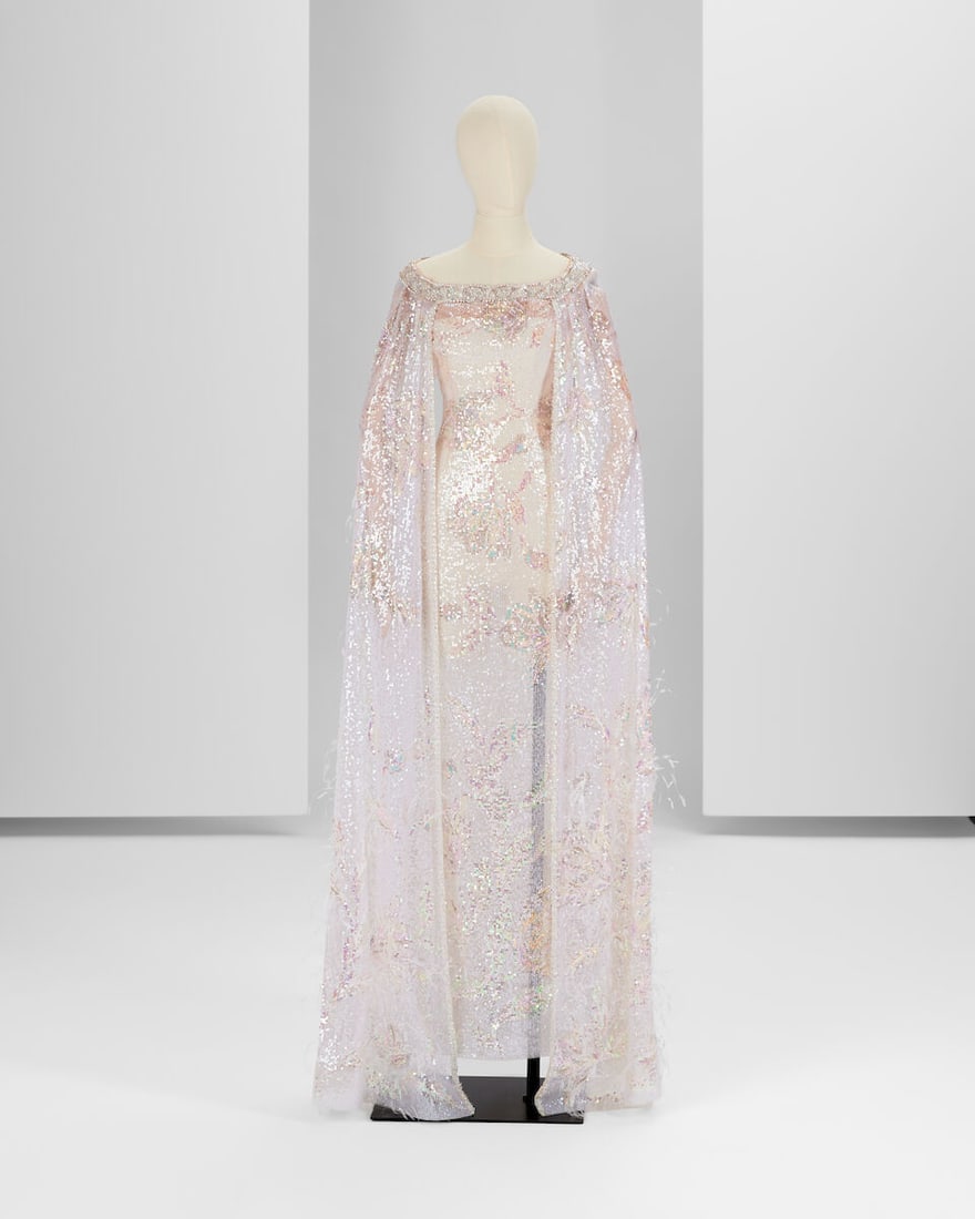 Ralph & Russo Haute Couture: Iridescent White Tulle Off-the-Shoulder Gown and Cape Autumn/Winter: Ralph & Russo Haute Couture: Iridescent White Tulle Off-the-Shoulder Gown and Cape Autumn/Winter 2018, Runway Look 28 Iridescent white tulle off-the-shoulder gown and cape in floral sequin