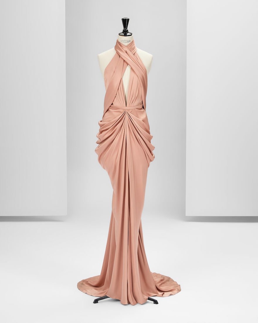 Ralph & Russo Haute Couture Exclusive: Champagne Pink Silk Satin Gown: Ralph & Russo Haute Couture Exclusive: Champagne Pink Silk Satin Gown Pink champagne double silk satin long halter neck gown featuring a pleated motif along the deep V-neck evolving into a soft ho