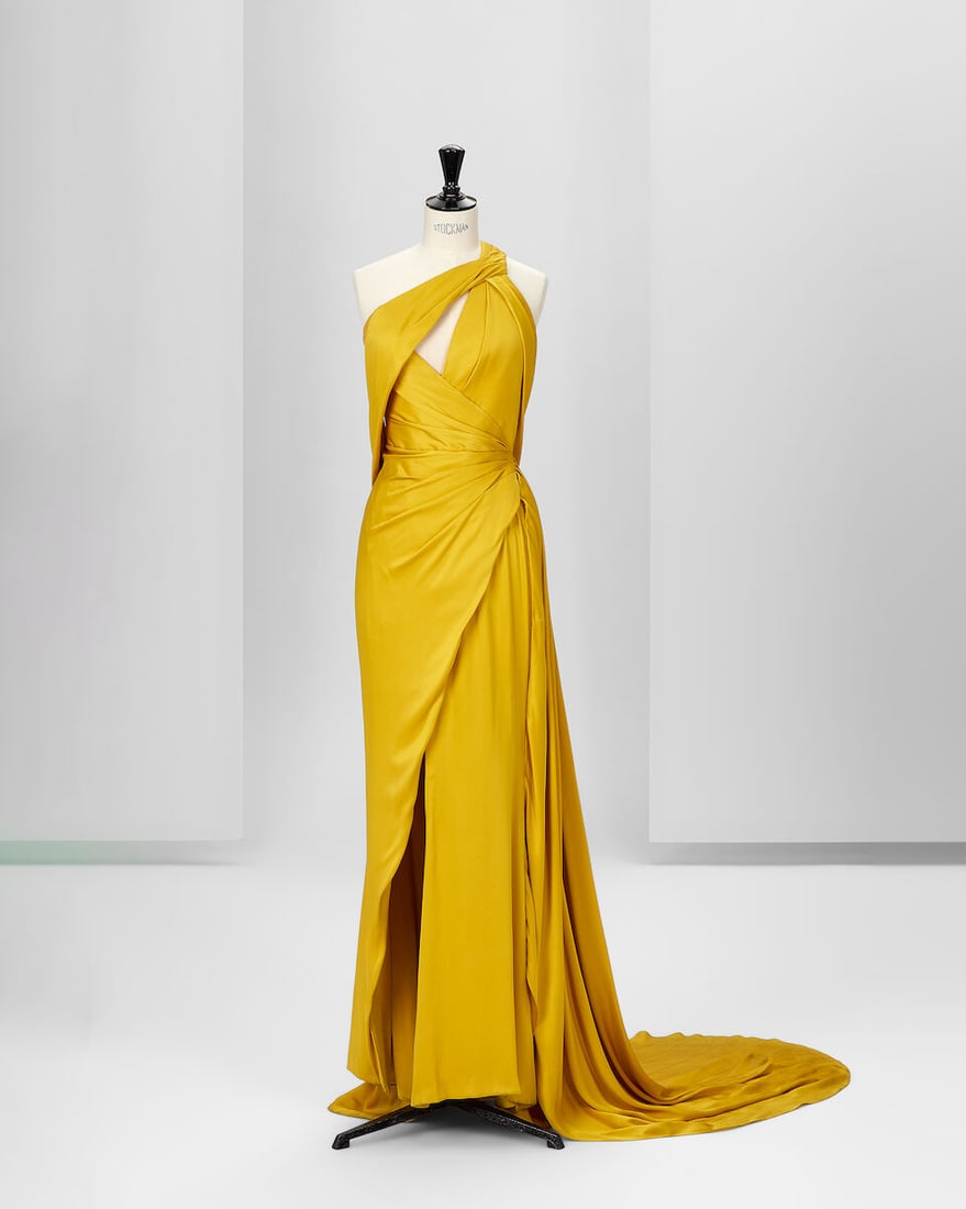 Ralph & Russo Haute Couture Exclusive: Mustard Silk Satin Gown: Ralph & Russo Haute Couture Exclusive: Mustard Silk Satin Gown Mustard double silk satin gown with asymmetric pleating featuring a triangle keyhole, long side train Approximate measurements: