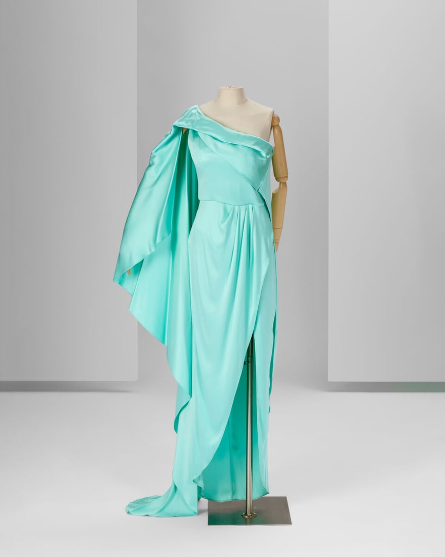 Ralph & Russo Ready To Wear: Oceana Blue Satin Dress: Ralph & Russo Ready To Wear: Oceana Blue Satin Dress Oceana double silk satin asymmetric dress featuring a cape-drape to floor length Approximate measurements - equivalent to French size 40: 