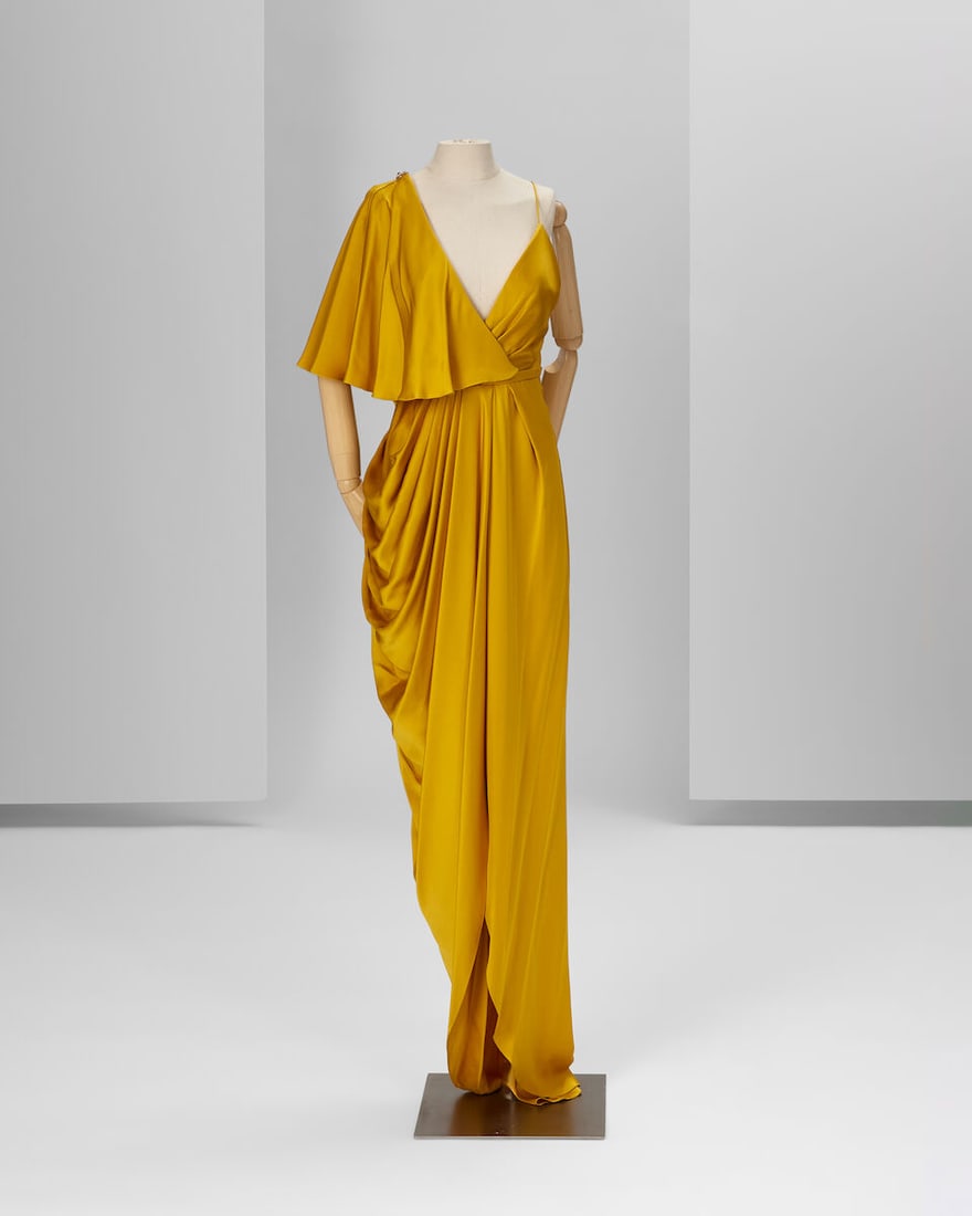 Ralph & Russo Haute Couture Exclusive: Mustard Silk Gown: Ralph & Russo Haute Couture Exclusive: Mustard Silk Gown Mustard double silk satin strap gown with asymmetric short cape featuring a hand embroidered strap with gold pearls and crystals, pleated