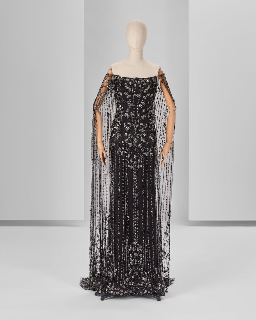 Ralph & Russo Haute Couture Exclusive: Black Embroidered Cape Gown: Ralph & Russo Haute Couture Exclusive: Black Embroidered Cape Gown Black silk duchess corset pencil dress layered with a hand embroidered black tulle off shoulders cape Approximate measurements: C