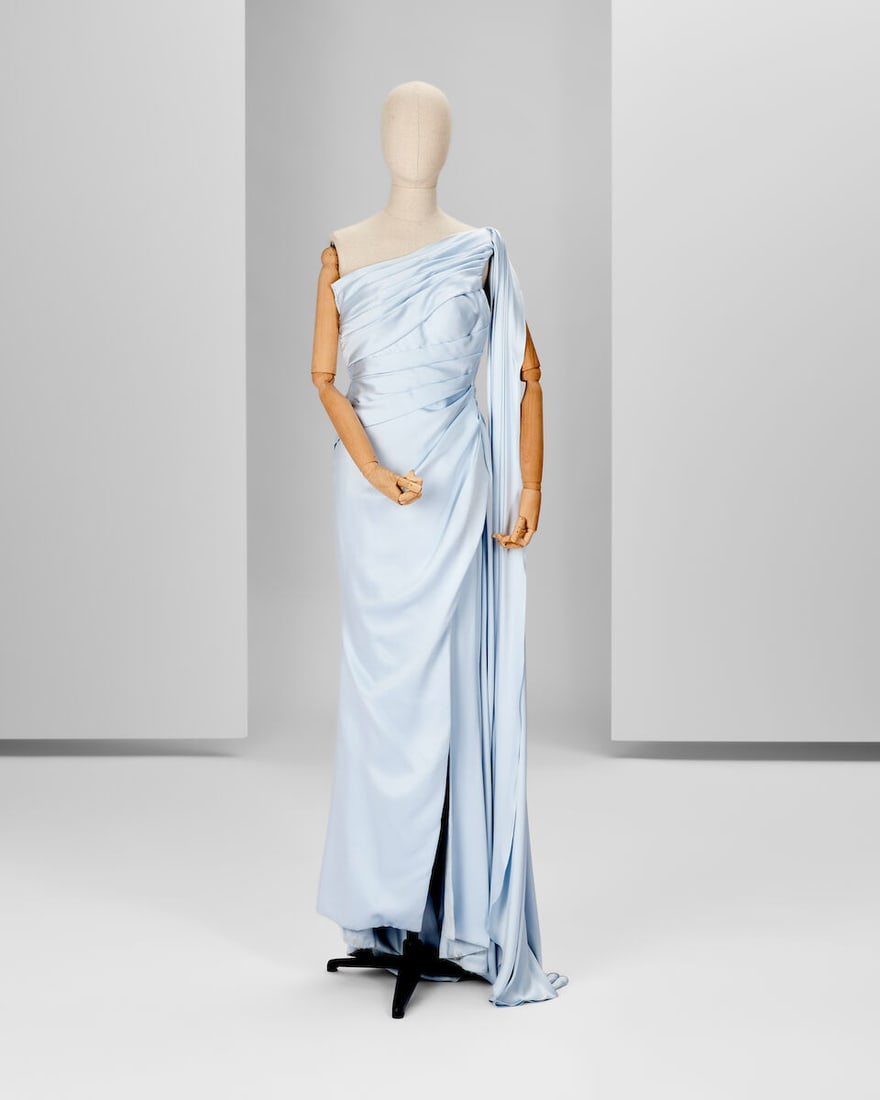 Ralph & Russo Haute Couture Exclusive: Light Blue Satin Gown: Ralph & Russo Haute Couture Exclusive: Light Blue Satin Gown Light blue double silk satin gown, asymmetrically draped with a side sash and thigh high side slit Approximate measurements: Chest