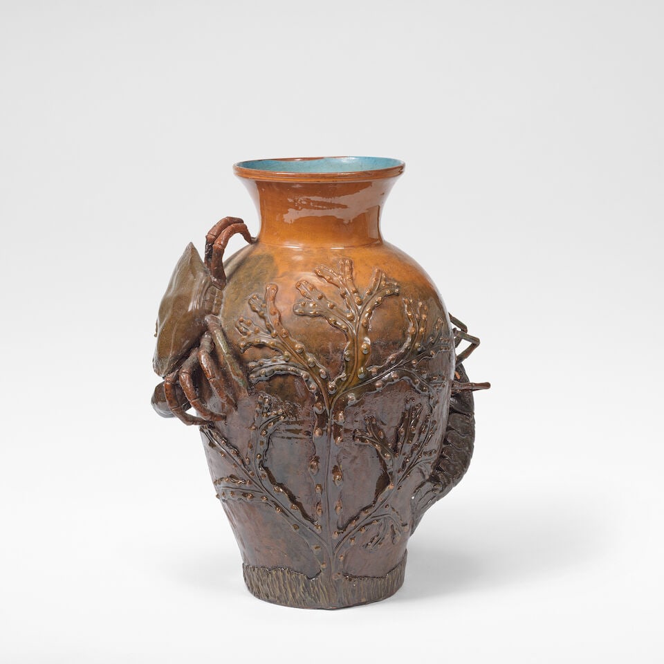 C H Brannam Pottery Large vase, 1886: C H Brannam Pottery Large vase, 1886 Earthenware, brown slip with sculpted additions of a crab and a lobster amongst marine foliage and an incised body, the interior glazed in blue. 46.5 cm high, 36
