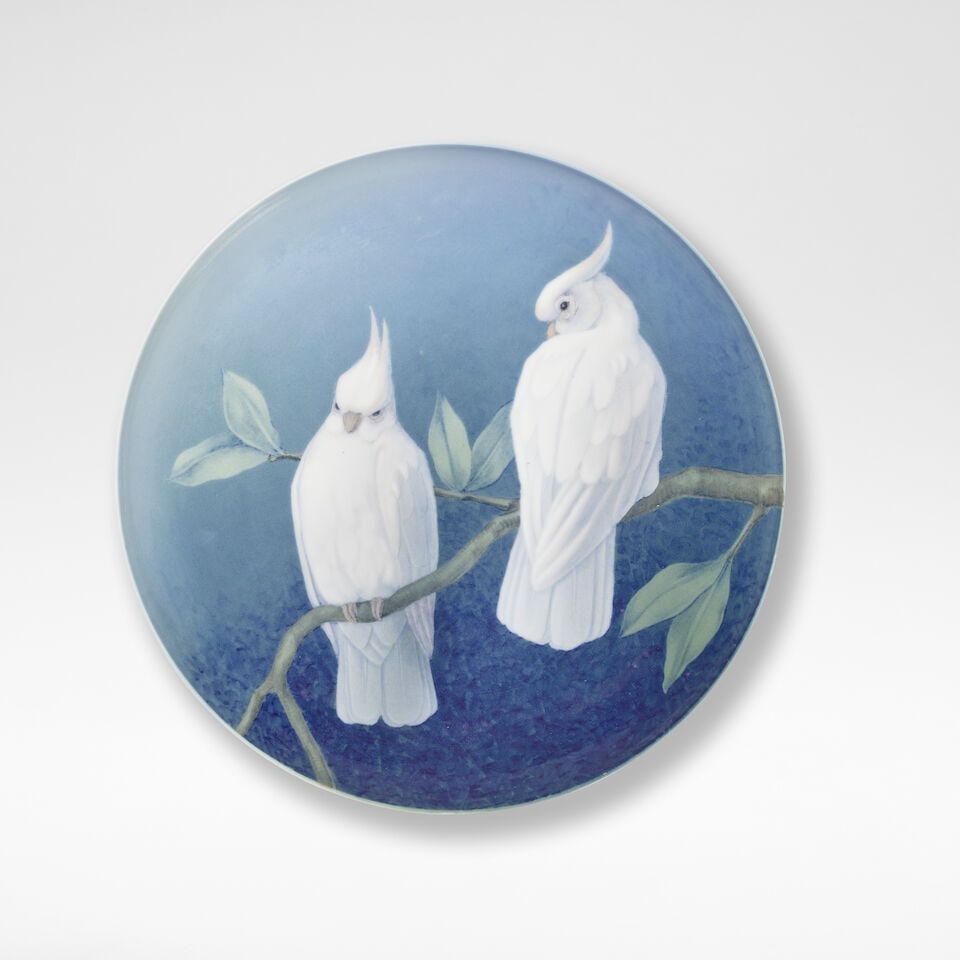 Effie Hegermann-Lindencrone for Bing & Grøndahl Charger, circa 1900: Effie Hegermann-Lindencrone for Bing & Grøndahl Charger, circa 1900 Porcelain, decorated with two parakeets against a blue ground. 32 cm diameter To the reverse with factory stamp used between