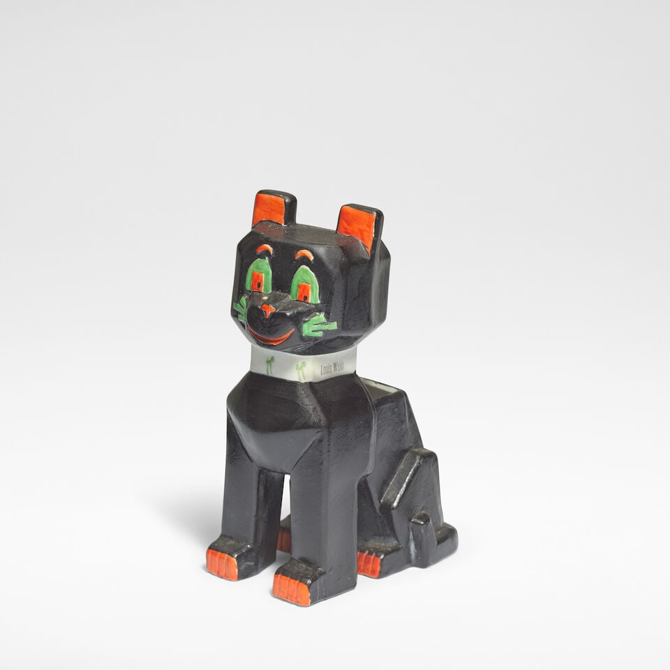 Louis Wain 'Lucky Black Cat' spill vase, designed 1915, executed circa 1930: Louis Wain 'Lucky Black Cat' spill vase, designed 1915, executed circa 1930 Bisque porcelain, decorated in polychrome. 12.5 cm high, 8 cm wide, 5.5 cm deep Stamped to the collar LOUIS WAIN, and to