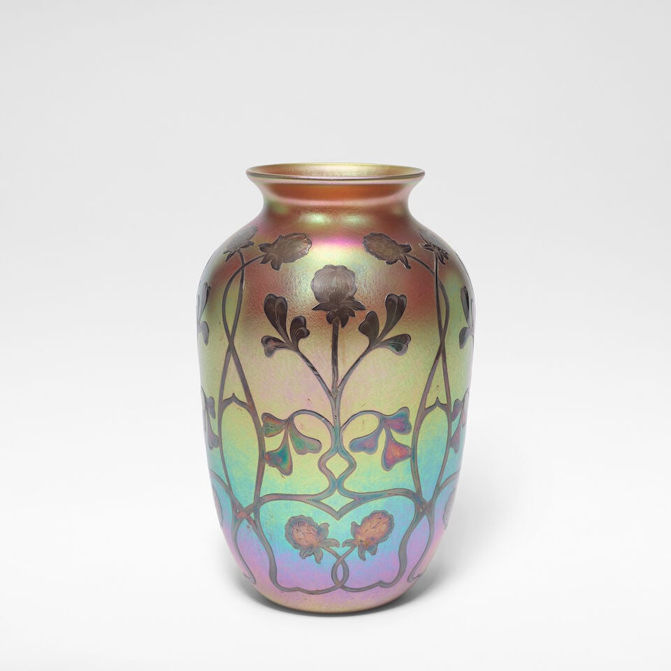 Quezal Glassworks Vase, circa 1910: Quezal Glassworks Vase, circa 1910 Iridescent glass, of bulbous form, overlaid with silver in stylised floral motifs. 28 cm high, 15 cm diameter Acid etched QUEZAL. For further information on this