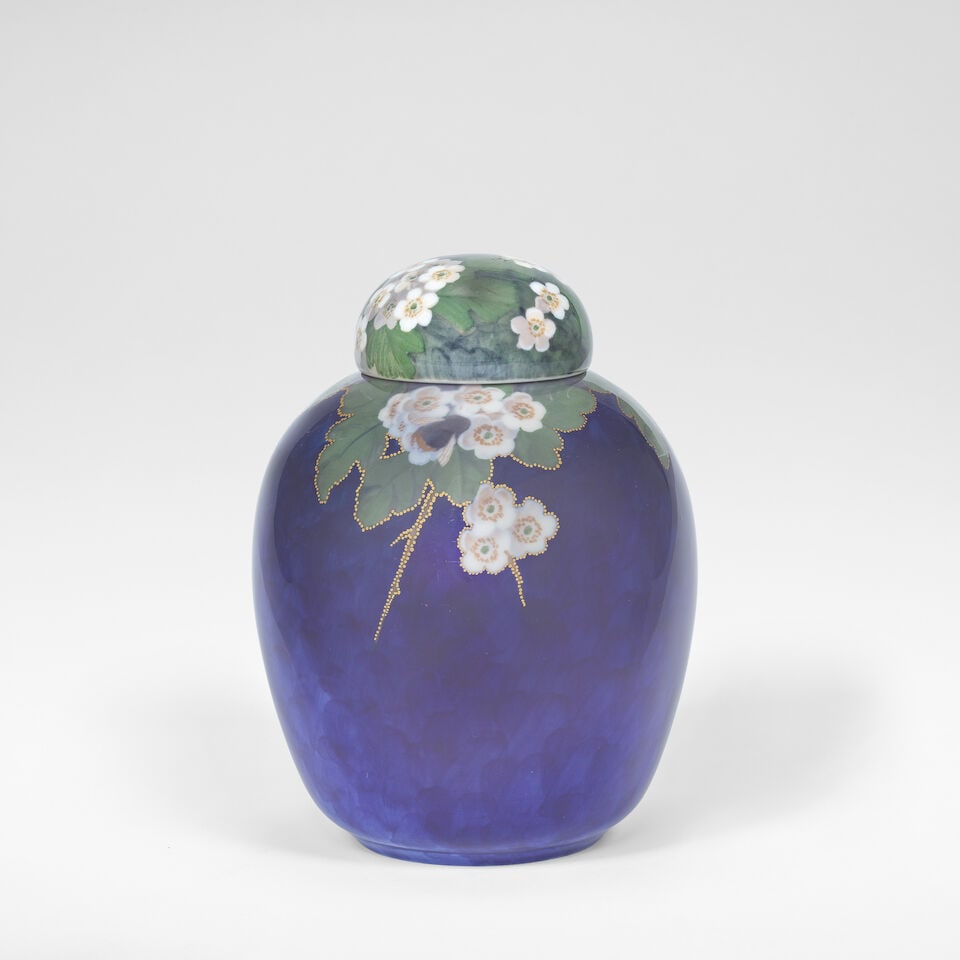 Royal Copenhagen Ginger jar and cover, circa 1910: Royal Copenhagen Ginger jar and cover, circa 1910 Porcelain, blue, green and white glazes and painted decoration of bees amongst foliage, with gilt details and rim. 20 cm high, 15 cm diameter Undersid