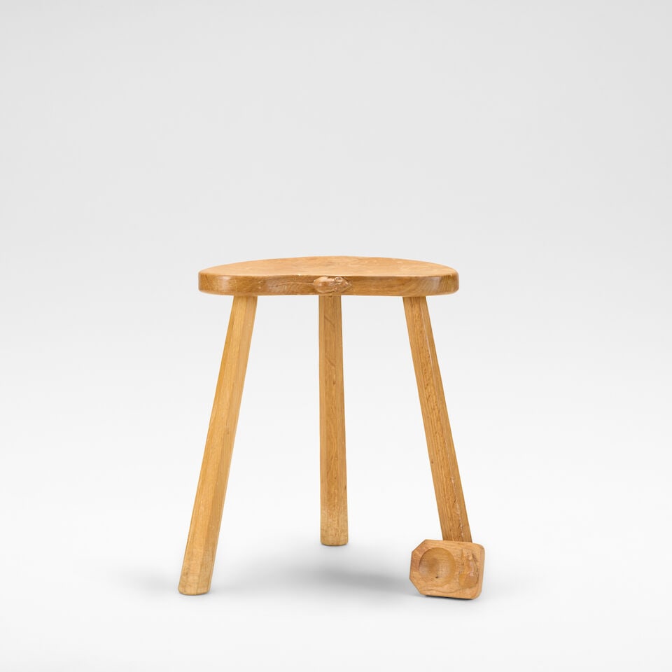 Robert 'Mouseman' Thompson Three-legged stool and ashtray, circa 1950: Robert 'Mouseman' Thompson Three-legged stool and ashtray, circa 1950 Oak, the adzed kidney shaped seat on three octagonal supports. 45 cm high, 43 cm wide, 34 cm deep With carved mouse to edge of