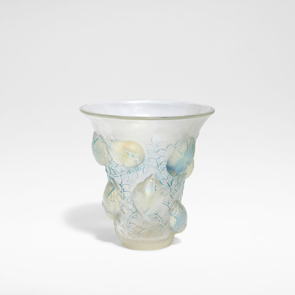 René Lalique 'Saint François' vase, designed 1930: René Lalique 'Saint François' vase, designed 1930 Frosted and opalescent glass highlighted with blue staining, of flared form, decorated in relief with birds among foliage. 17.5 cm high, 17
