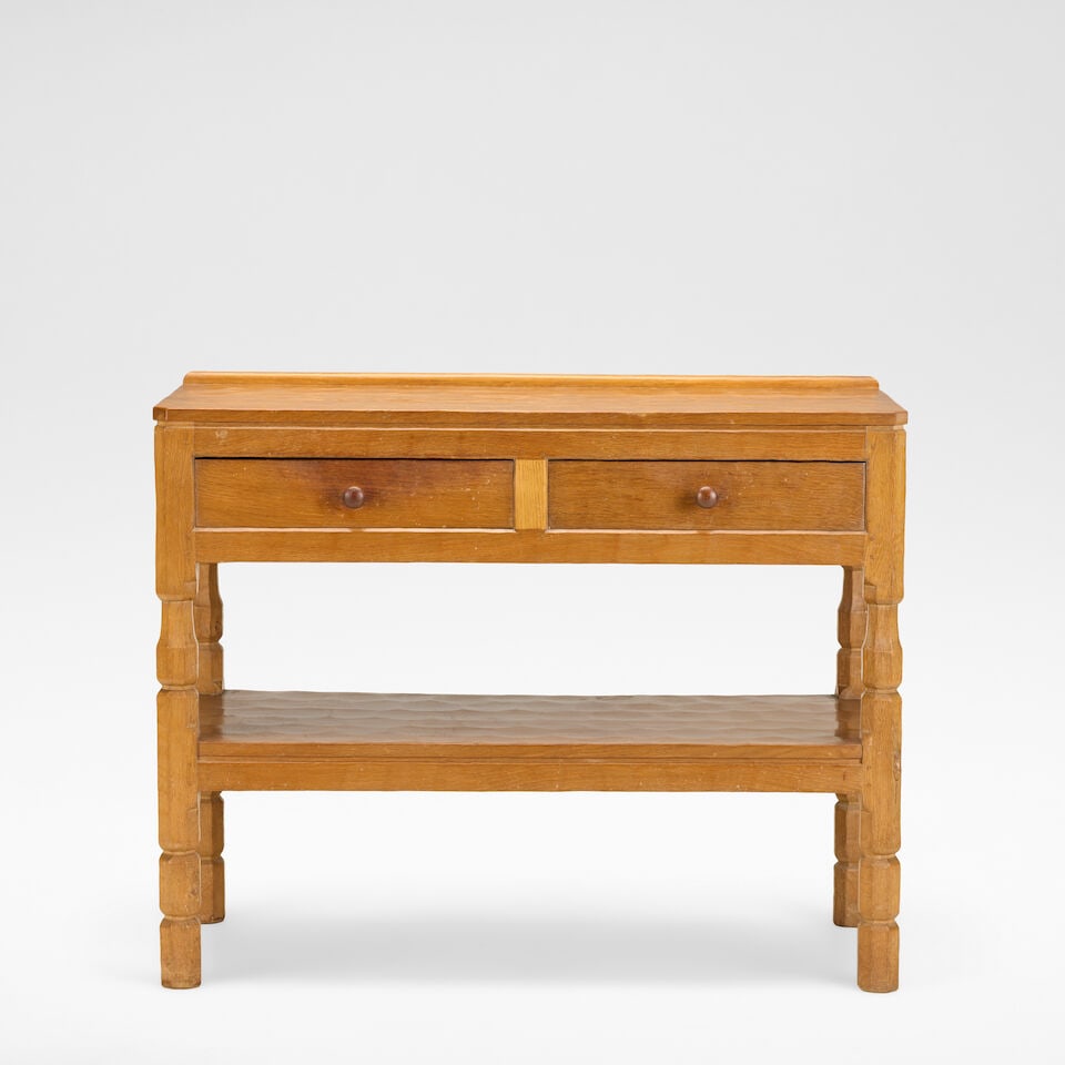 Robert 'Mouseman' Thompson Serving table, circa 1950: Robert 'Mouseman' Thompson Serving table, circa 1950 Oak, the adzed top over two frieze drawers, raised on octagonal supports. 84 cm high, 106.5 cm wide, 50 cm deep With carved mouse to front right