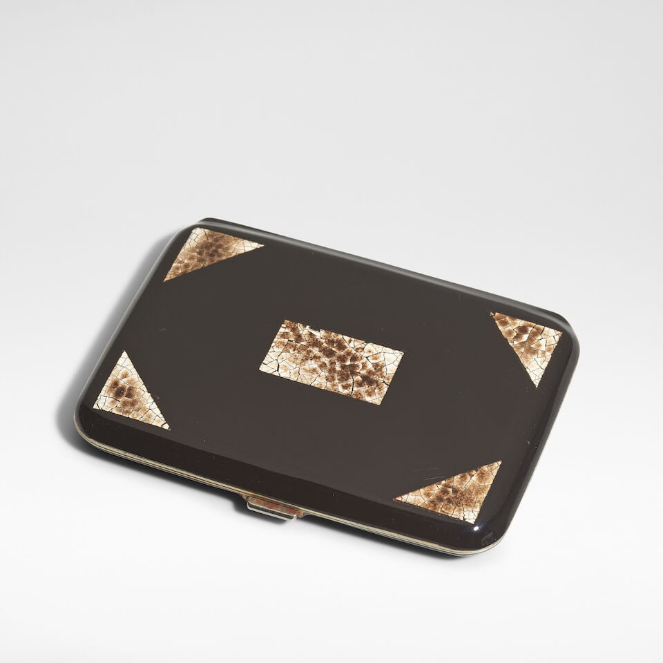 In the manner of Jean Dunand Art Deco cigarette case, circa 1930: In the manner of Jean Dunand Art Deco cigarette case, circa 1930 Coquille d'œuf lacquer on white metal, internally gilt. 8 cm high, 6 cm wide, 1 cm deep Footnotes: Provenance The Collection of