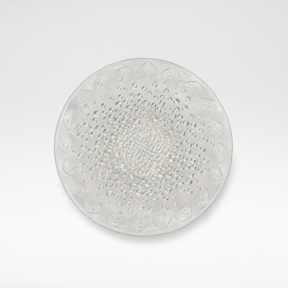 René Lalique 'Roscoff', charger, designed 1932: René Lalique 'Roscoff', charger, designed 1932 Opalescent glass, decorated with radiating fish against a moulded ground of high relief bubbles. 35 cm diameter Etched signature R. Lalique France