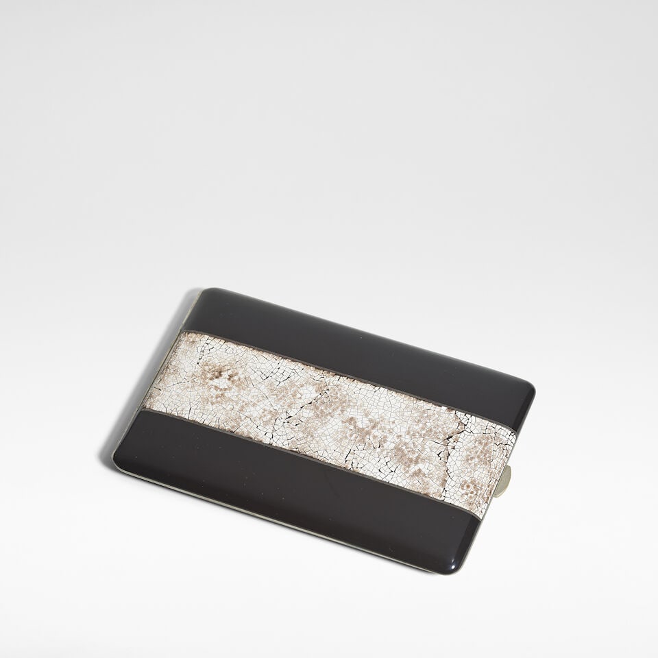 In the manner of Jean Dunand Art Deco cigarette case, circa 1930: In the manner of Jean Dunand Art Deco cigarette case, circa 1930 Coquille d'œuf lacquer on white metal, internally gilt. 12.5 cm high, 8 cm wide, 1 cm deep Footnotes: Provenance The Collection