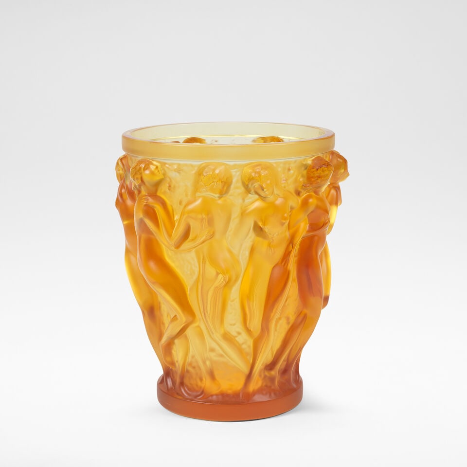 René Lalique 'Bacchantes Edition Anniversarie', vase, designed 1927, executed 2007: René Lalique 'Bacchantes Edition Anniversarie', vase, designed 1927, executed 2007 Amber coloured glass, moulded in relief with maidens. 24.5 cm high, 20.5 cm diameter With applied