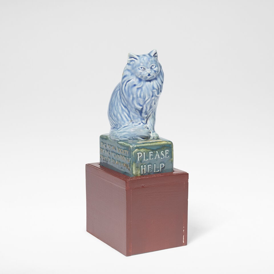 Doulton Lambeth RSPCA Collection box, circa 1900: Doulton Lambeth RSPCA Collection box, circa 1900 Stoneware, modelled as a seated cat, embossed to the front PLEASE HELP and to the sides THE ROYAL SOCIETY FOR THE PREVENTION OF CRUELTY TO