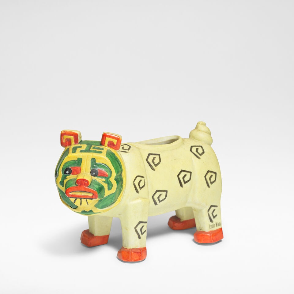 Louis Wain 'Lucky Bully Bulldog', spill vase, designed circa 1915, executed circa 1930: Louis Wain 'Lucky Bully Bulldog', spill vase, designed circa 1915, executed circa 1930 Bisque porcelain, decorated in polychrome. 9 cm high, 13 cm wide, 6 cm deep Stamped to the back paw LOUIS WAIN