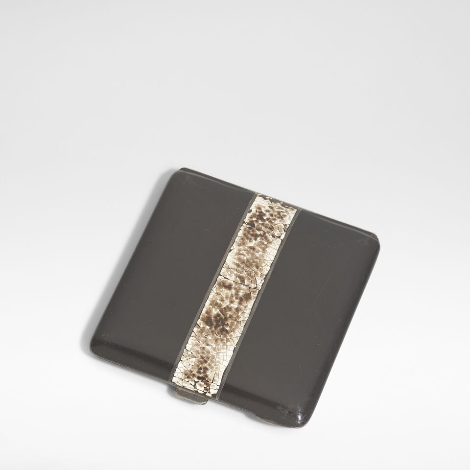 In the manner of Jean Dunand Art Deco cigarette case, circa 1930: In the manner of Jean Dunand Art Deco cigarette case, circa 1930 Coquille d'œuf lacquer on silvered metal. 7.5 cm high, 7.5 cm wide, 1 cm deep Footnotes: Provenance The Collection of Andy