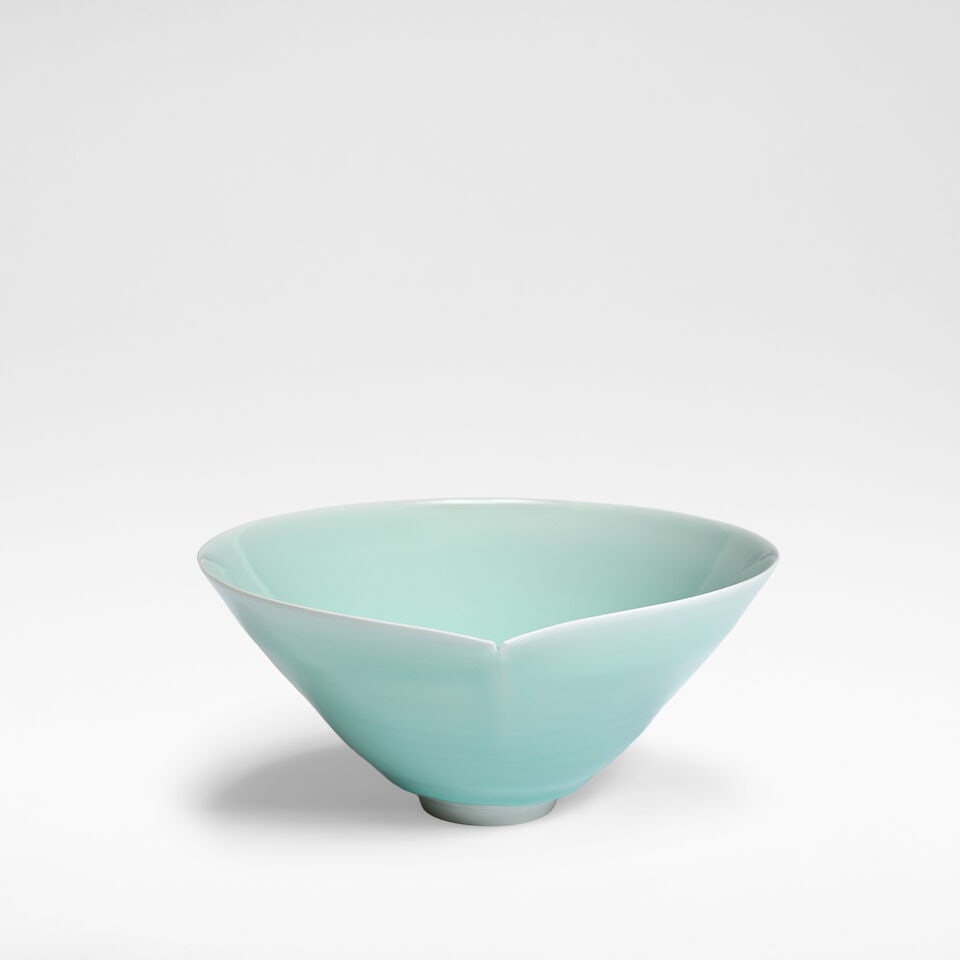 Fukami Sueharu Cut bowl: Fukami Sueharu Cut bowl Porcelain, poured blue celadon glaze, with a pinched and cut lip to the rim. 10.5 cm high, 22.2 cm wide, 21.5 cm deep Underside incised with artist's signature. Together with