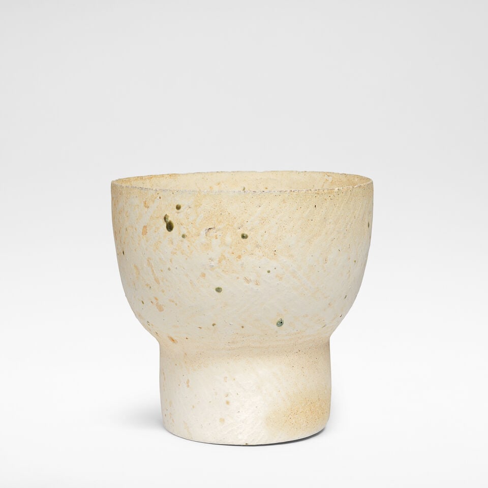 Paul Philp Footed vessel: Paul Philp Footed vessel Stoneware, dry mottled cream and brown glazes over a textured body, with a thick olive green speckle. 22 cm high, 23 cm diameter Underside impressed with artist's