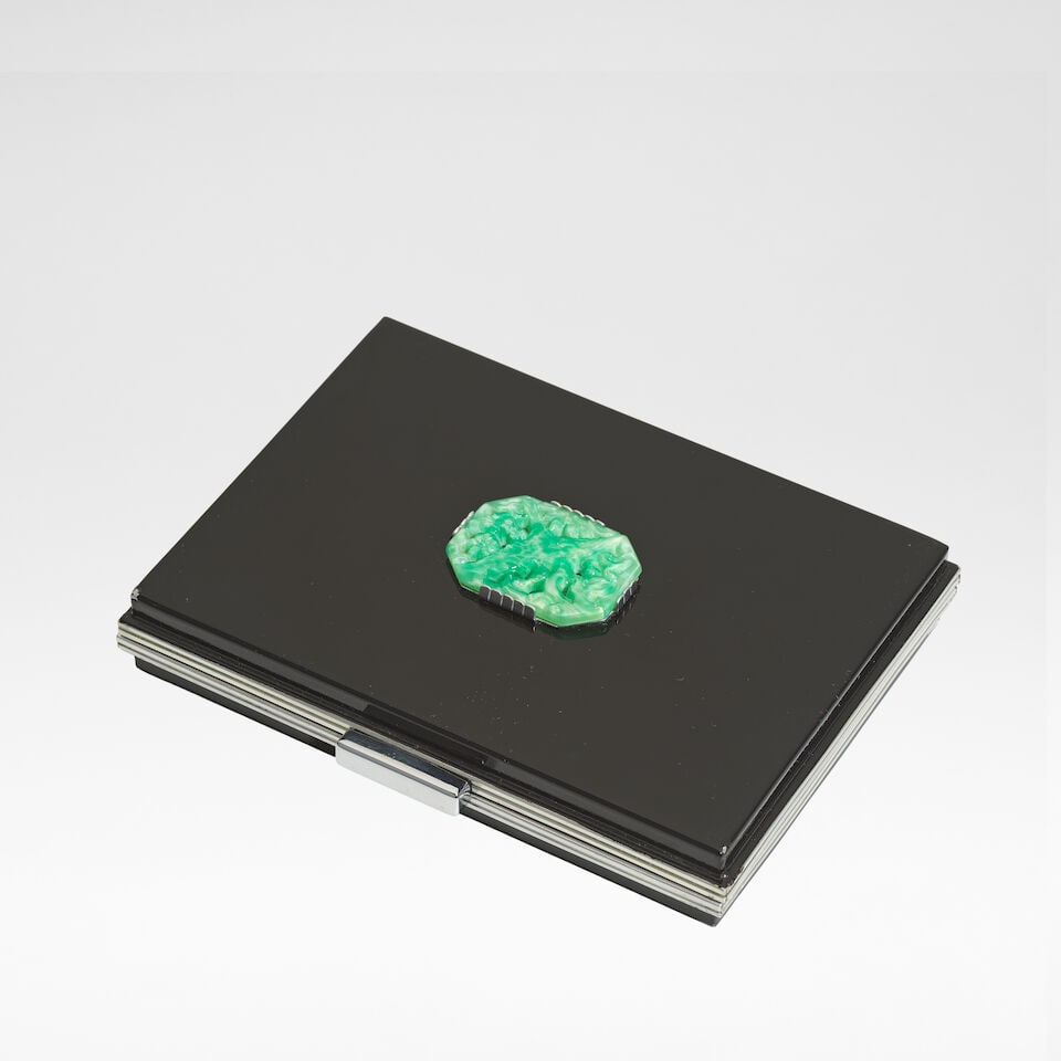 French Minaudière, circa 1938: French Minaudière, circa 1938 Enamel on chromed metal, the parcel-gilt interior with compartments and a mirror, set to the case with a composite cabochon in the centre modelled as a heron. 9 cm