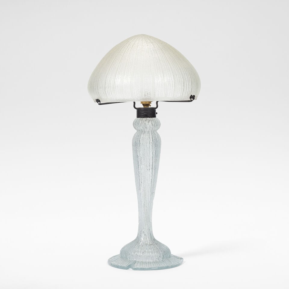 DAUM Nancy Table lamp, circa 1925: DAUM Nancy Table lamp, circa 1925 Acid etched glass, the mushroom shaped shade raised on a baluster shaped stem, deeply etched with vertical grooving. 67 cm high, 34 cm diameter Signed Daum Nancy