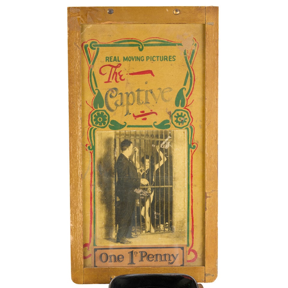 An early 20th century American Mutoscope pier head viewer with picture strip titled 'The Captive... - 4
